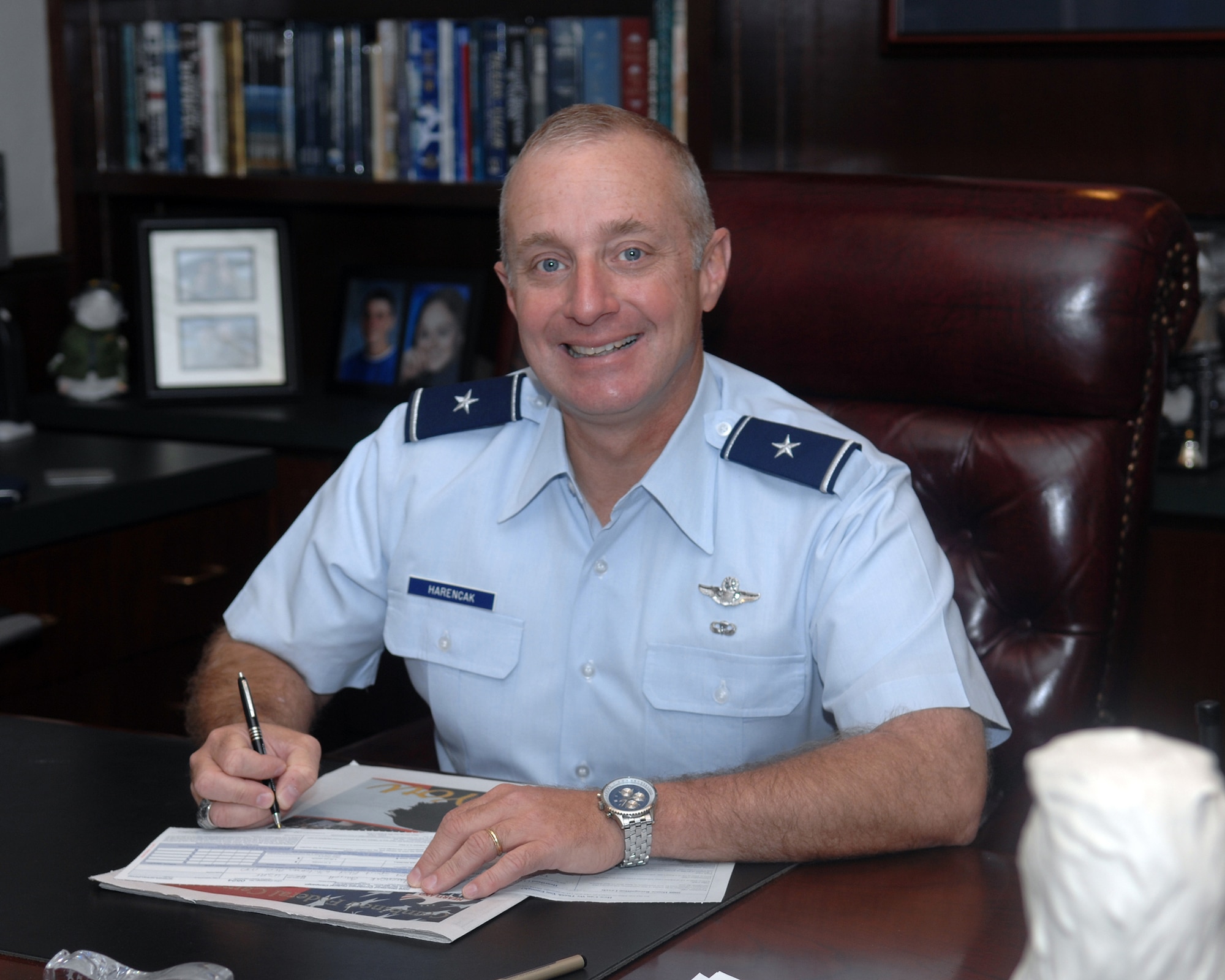 WHITEMAN AIR FORCE BASE, Mo. -Brig. Gen. Garrett Harencak, 509th Bomb Wing commander, reviews the Combined Federal Campaign contribution form Sept. 29. CFC is the world's largest and most successful annual workplace charity campaign, with more than 300 CFC campaigns throughout the country and internationally to help to raise millions of dollars each year. Pledges can be made by military donors during the campaign season, which runs from Oct. 1 - Nov. 12, to support eligible non-profit organizations that provide health and human service benefits throughout the world. (U.S. Air Force photo/Staff Sgt Charles D. Larkin Sr.)  