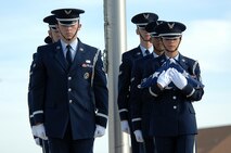 MINOT AIR FORCE BASE, N.D. – Marching in unison after retiring the colors, the members of the base honor guard descend the stairs during the POW/MIA Recognition Day retreat ceremony here Sept. 29. The ceremony was organized as a joint effort between the 5th Bomb Wing and 91st Missile Wing as a way to pay tribute to all prisoners of war and missing in action service-members, who have served, suffered and given their lives for our nation. (U.S. Air Force photo by Senior Airman Kelly Timney) 