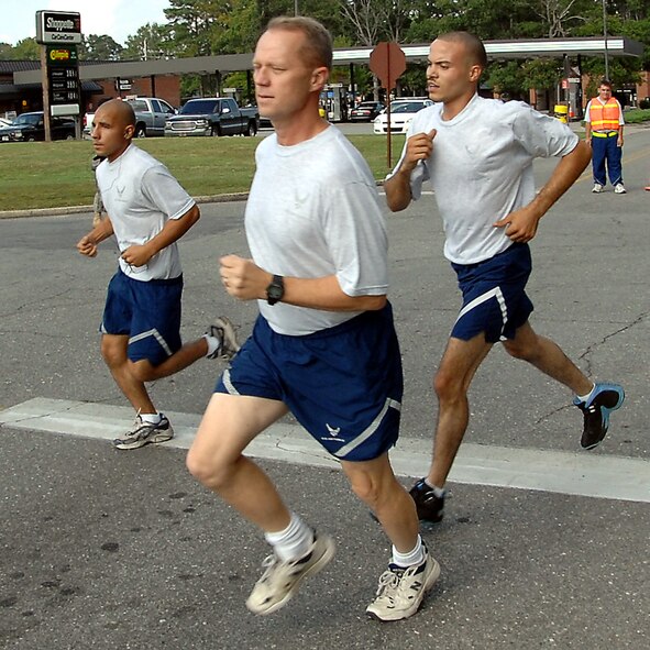 Members of the 4th Fighter Wing participate in a wing run initiated by base commander Col. Mark D. Kelly. Two tracks, both a mile and a half in length, were set up in the streets for the wing run lead by the commander. [U.S. Air Force photo by Airman 1st Class Rae Henline]