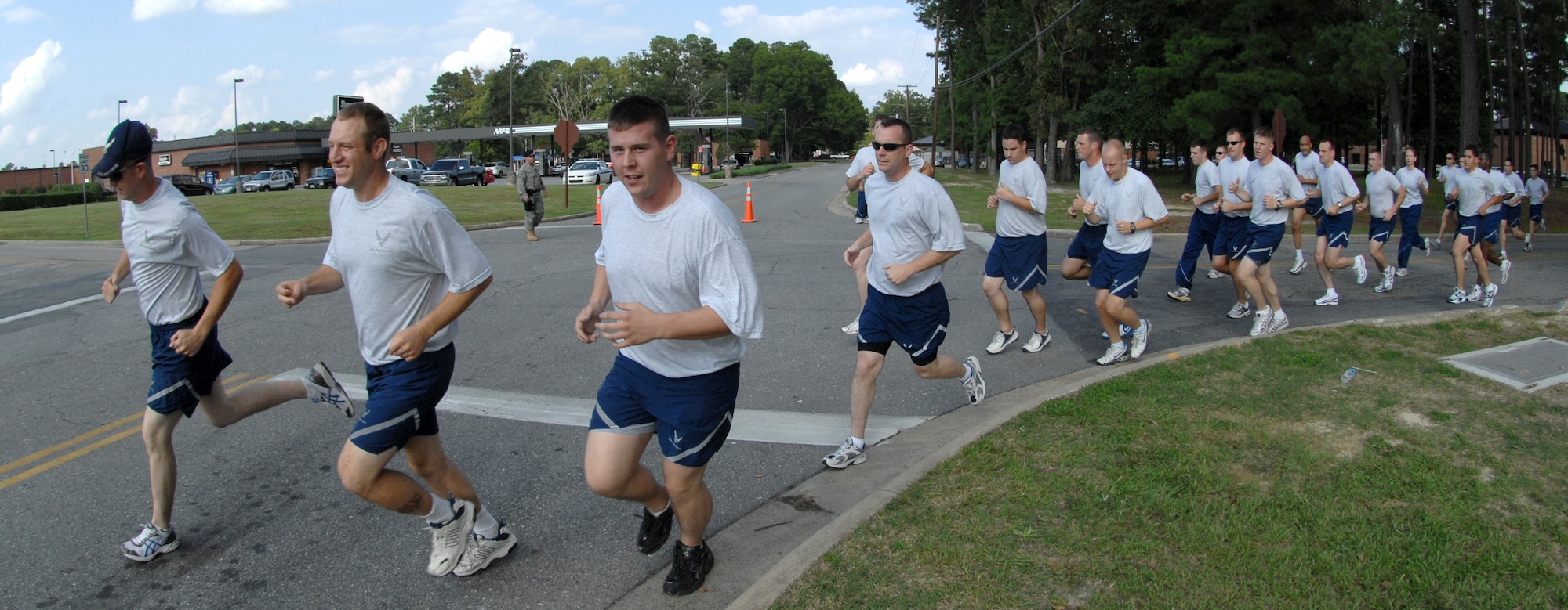 Members of the 4th fighter wing participate in a wing run instated by base commander Col. Mark D. Kelly. Two tracks, both a mile and a half in length, were set up in the streets for the wing run lead by the commander. [U.S. Air Force photo by Airman 1st Class Rae Henline]