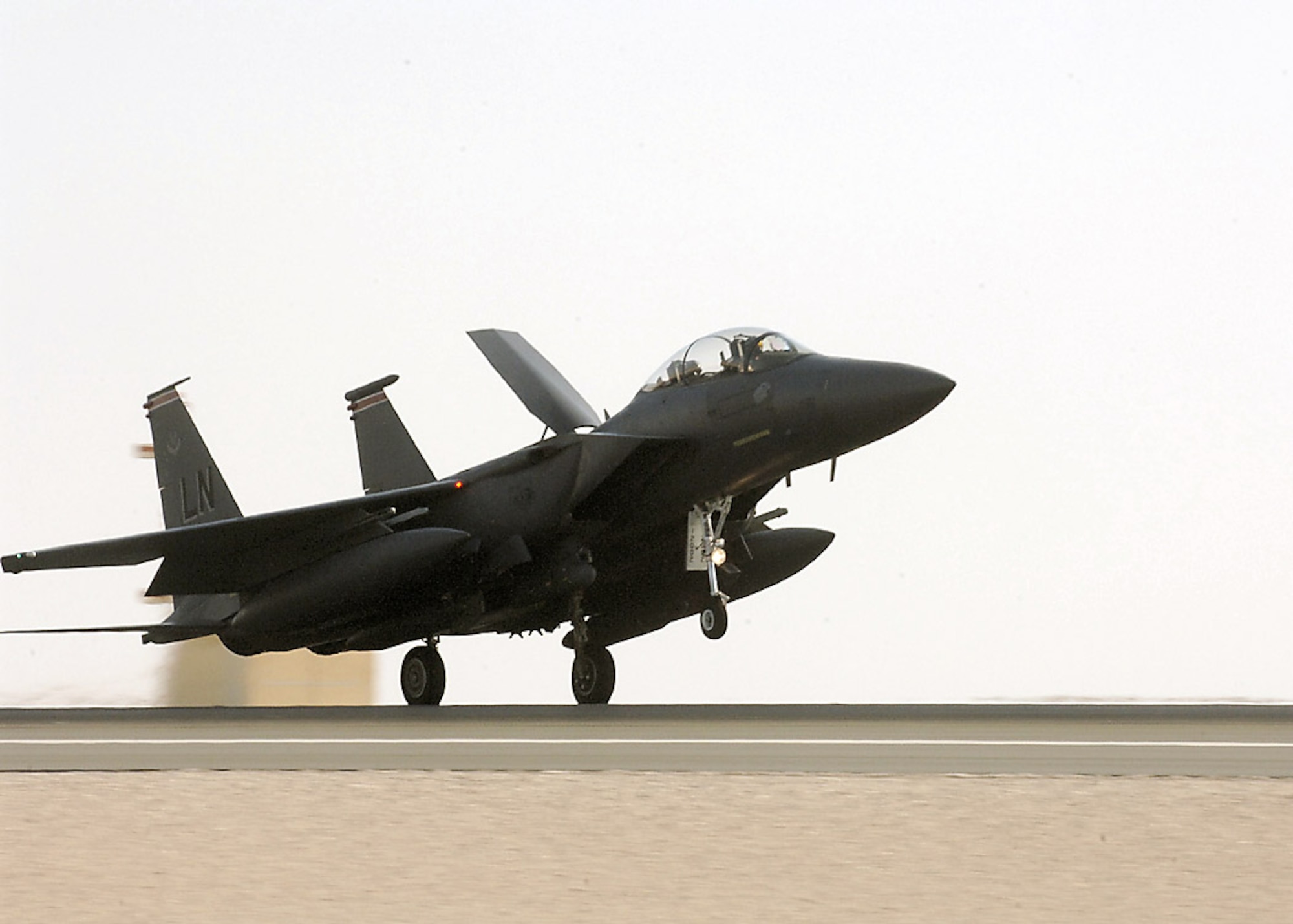 An F-15E Strike Eagle touches down after a mission in Southwest Asia.  Strike Eagles provide overwatch and perform shows of force to deter enemy activity and protect coalition forces. (U.S. Air Force photo)