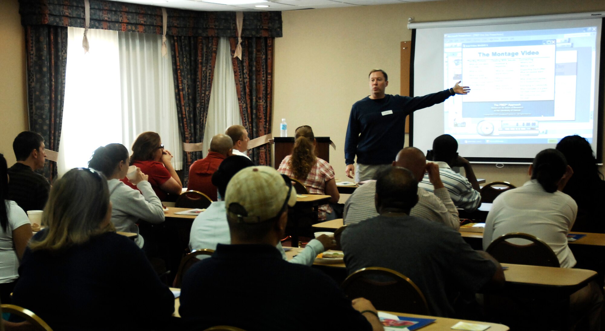 CANNON AIR FORCE BASE, N.M. -- Ch.(Capt.) Donald Bridges, 27th Special Operations Wing, talks to married couples during the Happy, Healthy Families workshop Sept. 26. The seminar taught couples the warning signs of an unhealthy relationship. (U.S. Air Force photo/Airman 1st Class Evelyn Chavez)  