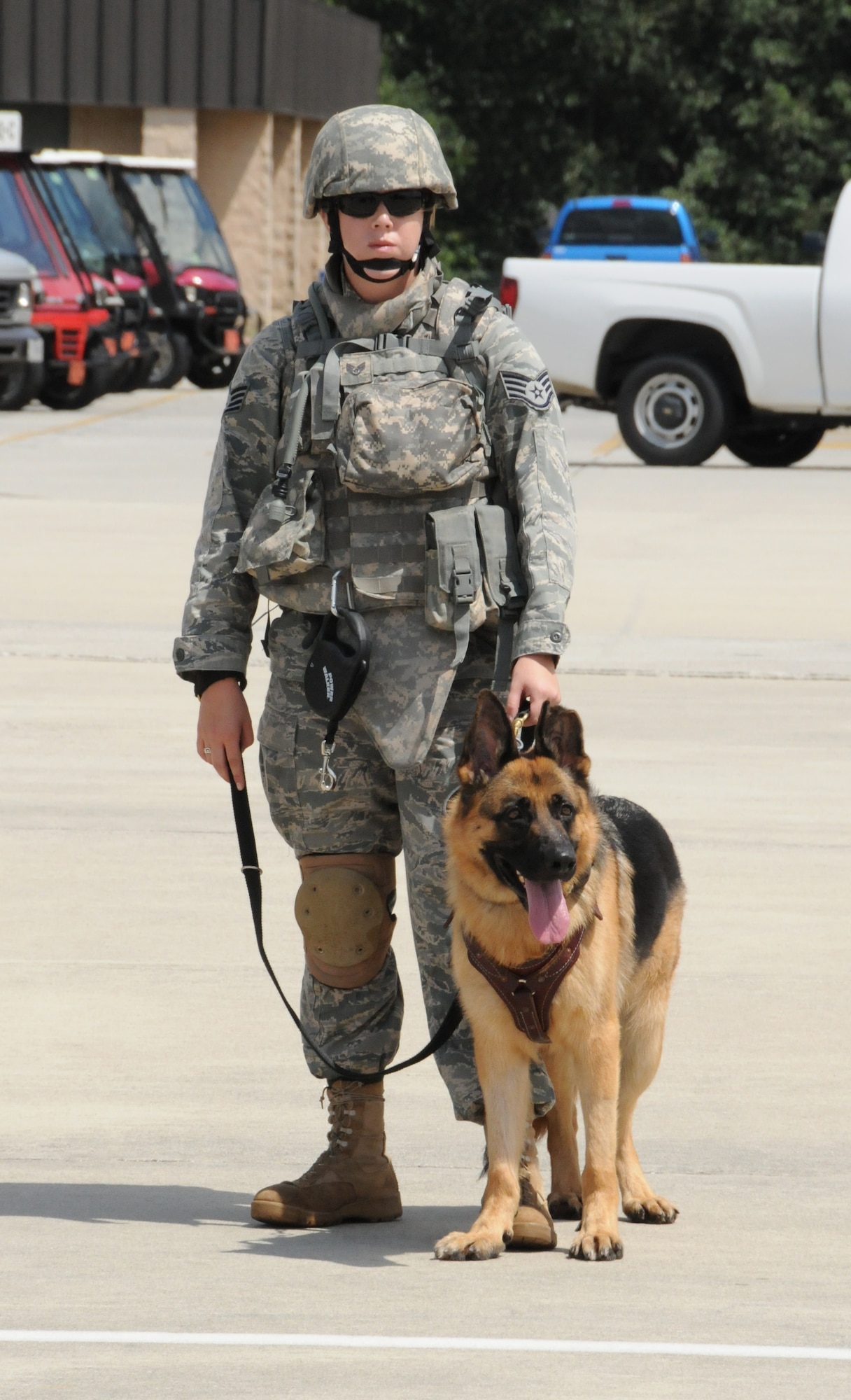 FORT RUCKER, Ala. -- Staff Sgt. Kathleen Lee and her military working dog (MWD), Cezar, prepare to take their first CH-47 Chinook flight together. (Photo by Michelle Owens)
