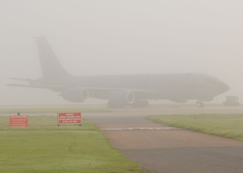 A KC-135 takes cover under a thick blanket of fog during the early morning at RAF Mildenhall, England Sept. 26, 2008. Dense fog can make for zero visibility. Base Safety Office personnel  caution everyone to take more time and to be alert during morning activities. (U.S. Air Force by Staff Sgt. Jerry Fleshman)