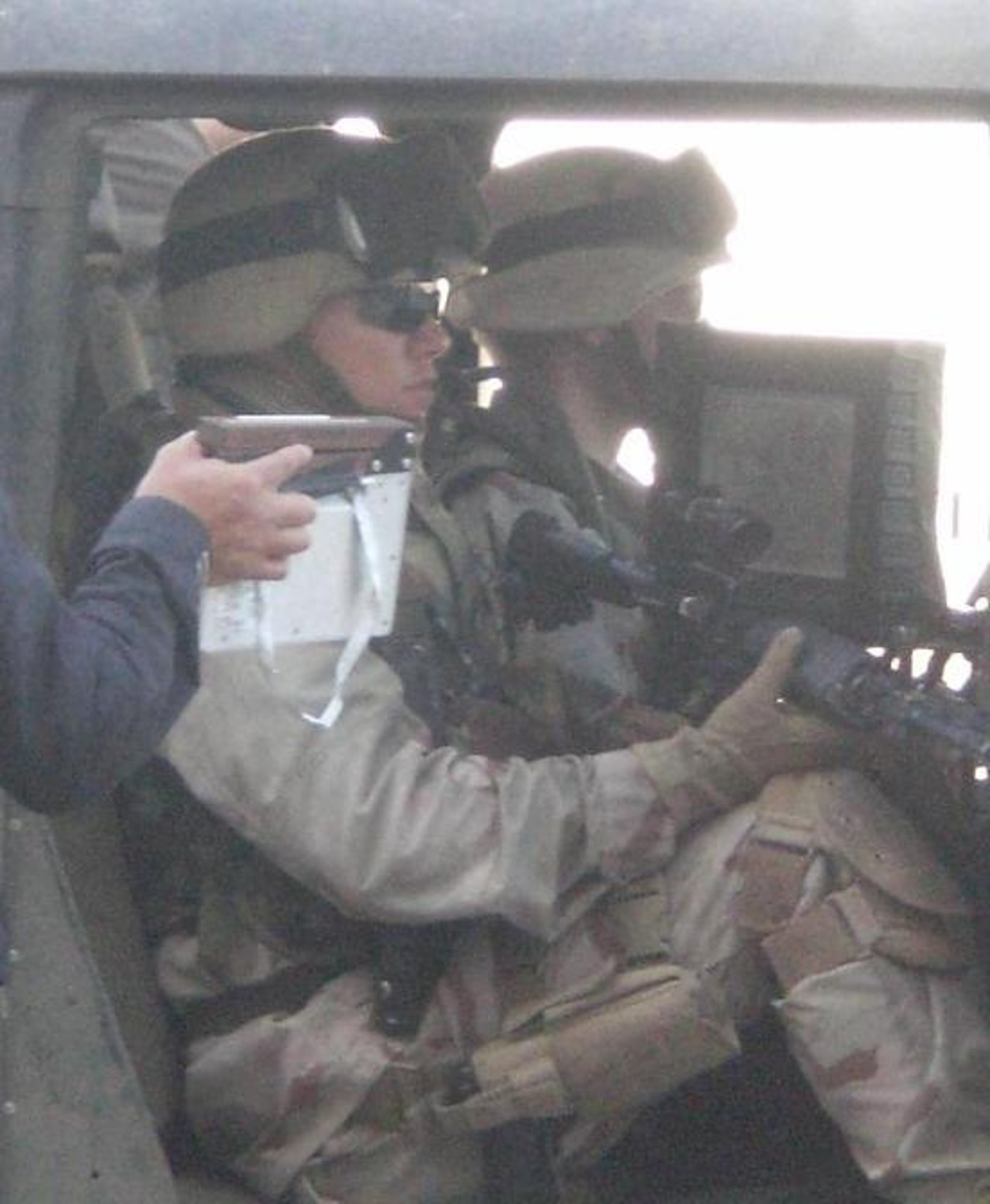 A production assistant holds a clapper board as cameras begin to roll on JAC Sgt. First Class Christopher C. Slaughter sitting in a HHMMWV during the filming of the upcoming film Green Zone starring Matt Damon. The clapper board contains the basic informtion on the scene being shot.  Slaughter served as the body double for Damon (Chief Warrant Officer Roy Miller in the film) in several scenes.  Sgt. First Class Slaughter is currently attending the Army's Advanced NCO course at Fort Huachuca, Arizona. (Photo courtesy of Christopher Slaughter)