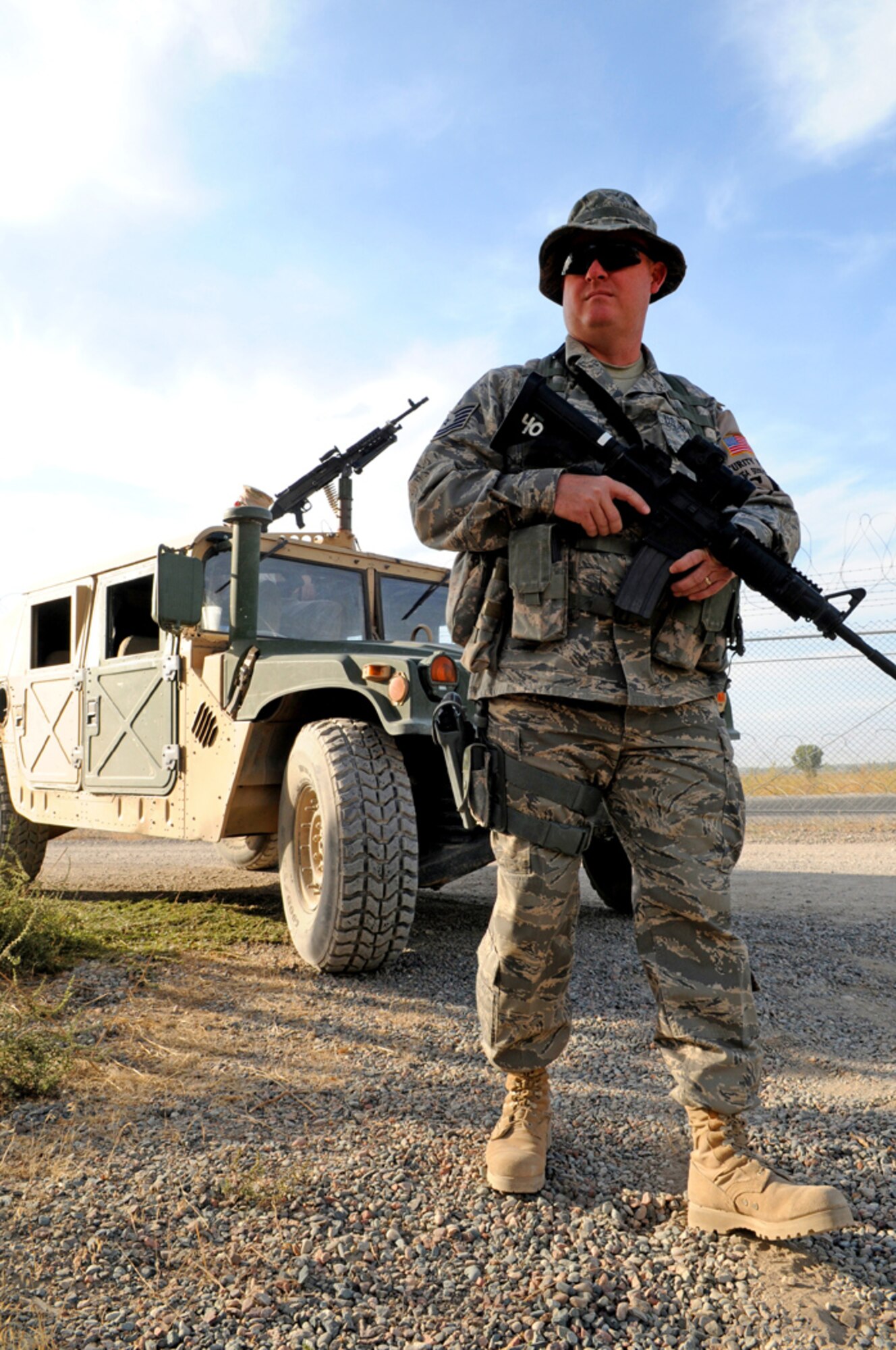 MANAS AIR BASE, KYRGYZ REPUBLIC - Tech Sgt. Chad Niccum, a member of the 376th Expeditionary Security Forces Squadron quick response force, patrols the base here, Sept. 27. The 376th ESFS is the base's protects the base from any threats it may face from both inside and outside the perimeter. (Air Force photo / Senior Airman Ruth Holcomb)
