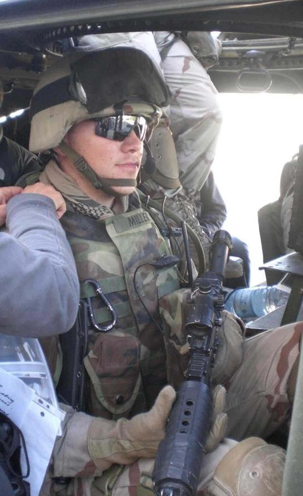 JAC Sgt. First Class Christopher C. Slaughter has his uniform adjusted by a costume assistant on the set of the upcoming film Green Zone starring Matt Damon.  The JAC NCO served as the body double for Damon (Chief Warrant Officer Roy Miller in the film) in several scenes and also provided advice on the set.  In his Army career, the combat veteran 25-year old Sgt. First Class was the youngest member of the U.S. Army promoted to his current rank this year. (Photo courtesy of Christopher Slaughter)