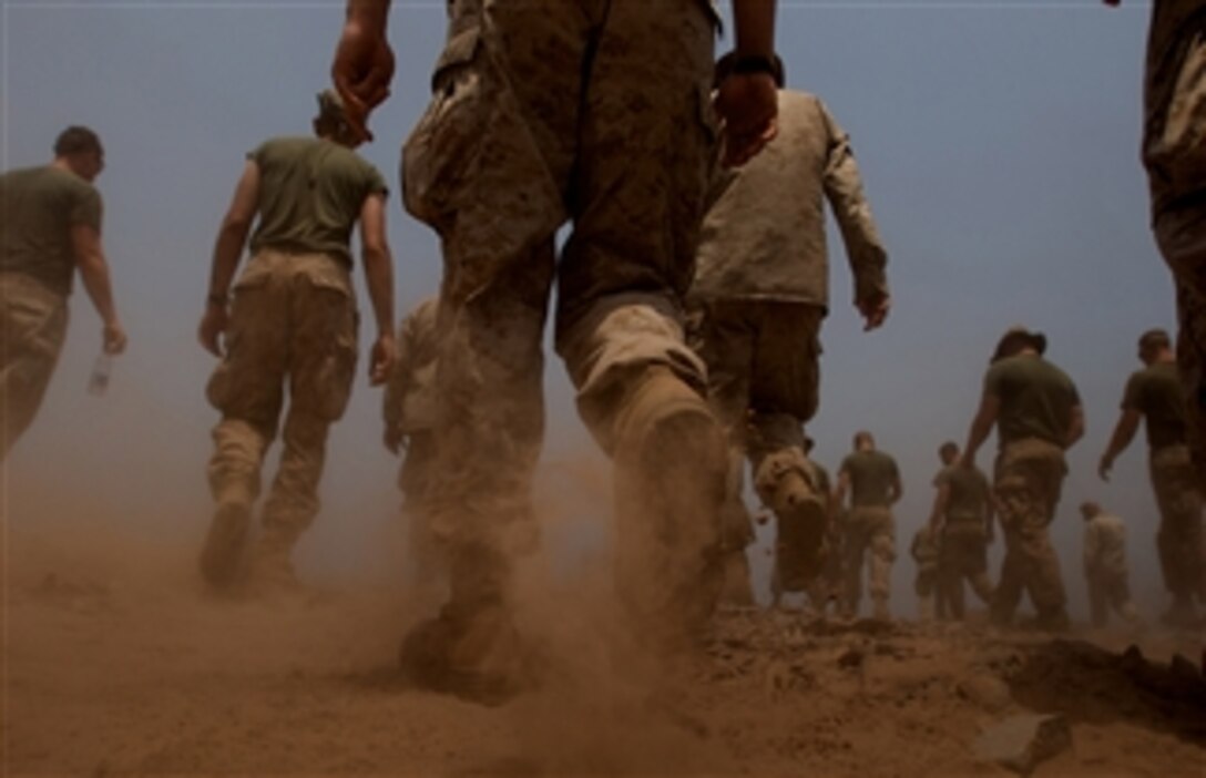 U.S. Marines from the 9th Provisional Security Company search for spent brass after a morning of firing at a weapons range at Camp Lemonier, Djibouti, on Sept. 24, 2008.  The company is part of Combined Joint Task Force - Horn of Africa.  