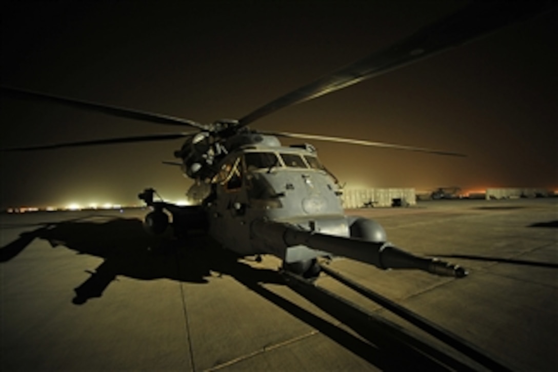 A U.S. Air Force MH-53 Pave Low helicopter from the 20th Expeditionary Special Operations Squadron sits on the tarmac prior to a final combat mission at Joint Base Balad, Iraq, on Sept. 27, 2008.  The Pave Low is being retired after nearly forty years of service to the Air Force.  