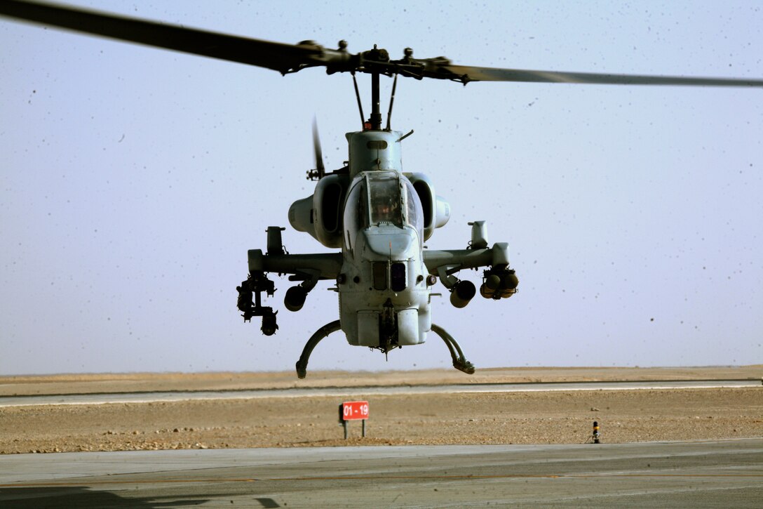 An AH-1W Super Cobra assigned to Marine Light Attack Helicopter Squadron 269 takes off from the Camp Bastion flight line to provide support to the Marines of Task Force 2d Battalion, 7th Marine Regiment, Special Purpose Marine Air Ground Task Force Afghanistan, Sept. 30.  (U.S. Marine Corps photo by Sgt. Steve Cushman)