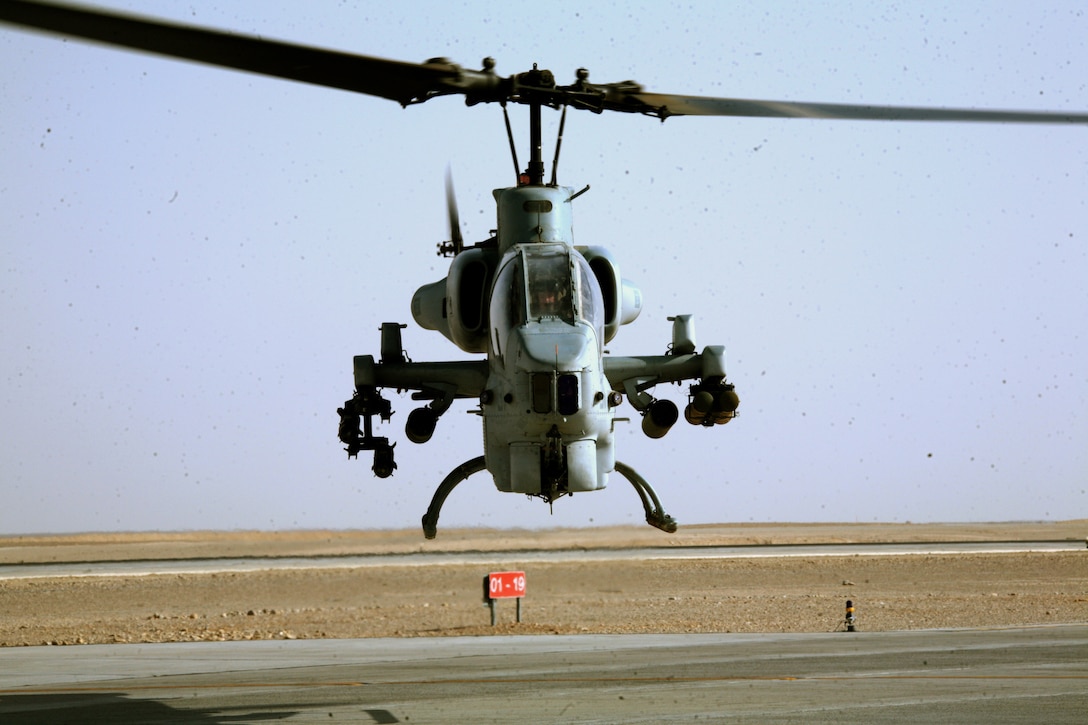 An AH-1W Super Cobra assigned to Marine Light Attack Helicopter Squadron 269 takes off from the Camp Bastion flight line to provide support to the Marines of Task Force 2d Battalion, 7th Marine Regiment, Special Purpose Marine Air Ground Task Force Afghanistan, Sept. 30.  (U.S. Marine Corps photo by Sgt. Steve Cushman)