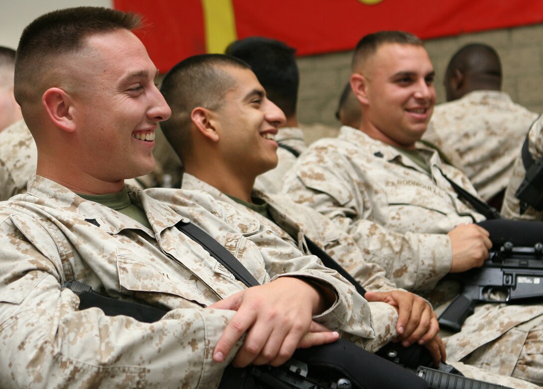 Marines with Marine Wing Support Squadron 373, Marine Wing Support Group 37, 3rd Marine Aircraft Wing, share a few jokes before departing for Iraq from Marine Corps Air Station Miramar, Sept. 30. The squadron will send more than 500 Marines to Iraq during the course of one month, in support of airfield operations and coalition forces.  (U.S. Marine Corps photo by Lance Cpl. Christopher O'Quin) (Released)