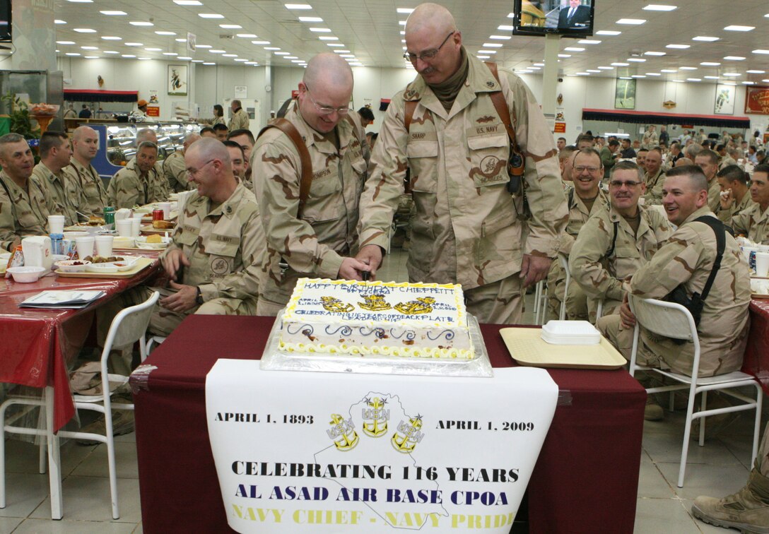 Chief Petty Officer David Sharp (right) and Chief Petty Officer Jack Thompson(left),  cut the birthday cake during  the Chief Petty Officer Birthday Celebration April 1, 1893.  Sharp was the oldest Chief at the clebration and Thompson was the youngest. (U.S. Marine Corps photo by Cpl Alan Addison)