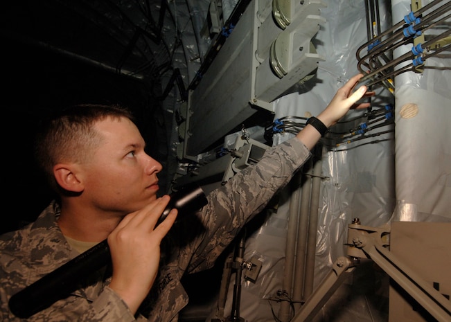 Tech. Sgt. Robert Pellam inspects cargo door hydraulic lines for leaks or breaks inside a C-17 here April 1. Quality assurance checks are performed to ensure maintenance quality, personal safety, reliability and flight safety are adhered to for the 437th Maintenance Group. Sergeant Pellam is a fabrication quality inspector with the 437th Maintenance Group. (U.S. Air Force photo/Senior Airman Timothy Taylor)