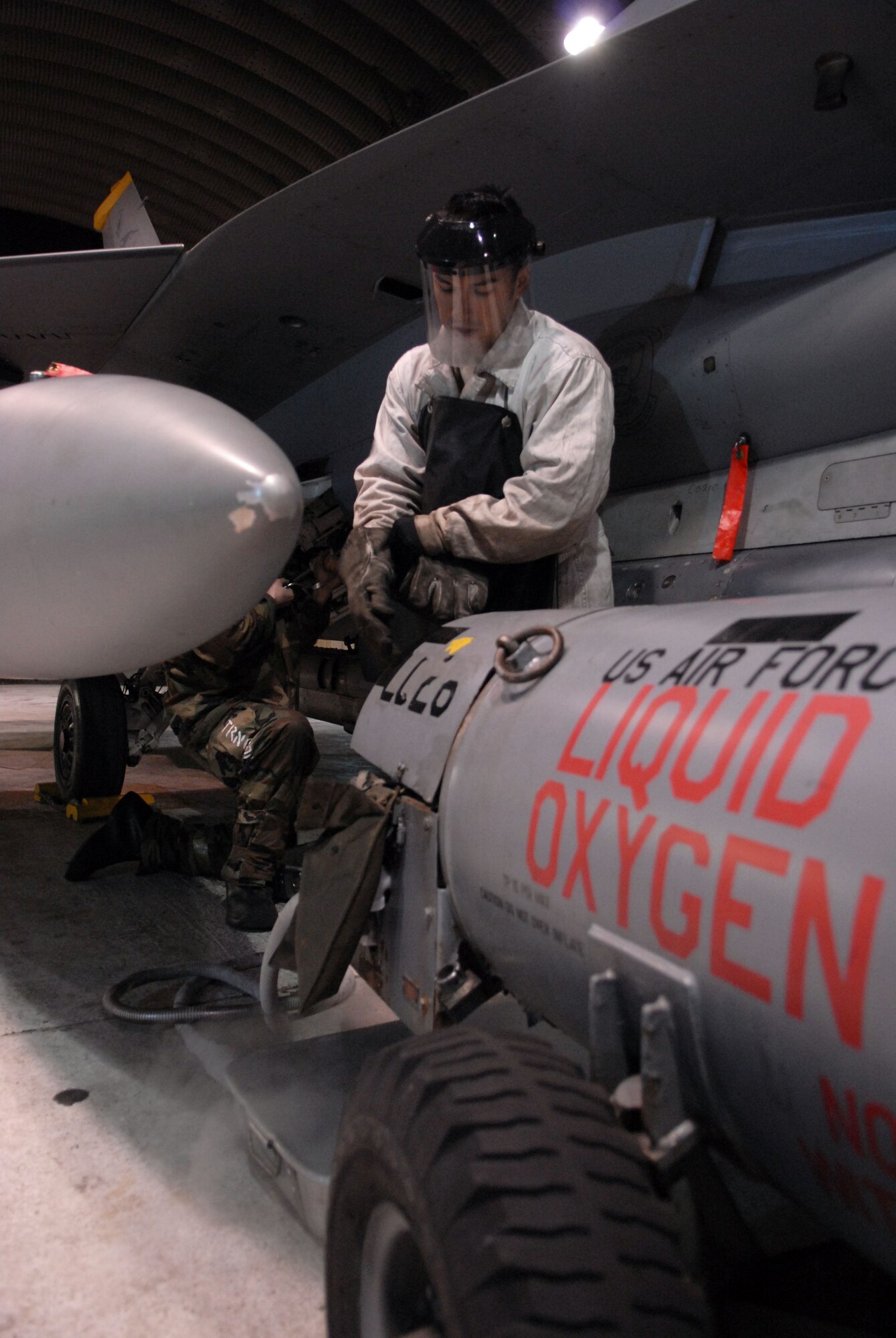 Senior Airman Amed Poveda, 80th Aircraft Maintenance unit conducts a liquid oxygen servicing on an F-16 at Kunsan Air Base, Republic of Korea, during the beverly bulldog 09-02 peninsula-wide operational readiness exercise April 2, 2009.  The task ensures the pilot's oxygen system is properly maintained for the next use.  The Wolf Pack is practicing its war time capabilities in the PENORE to properly prepare for an upcoming Operational Readiness Inspection.(US Air Force Photo By: Senior Airman Angela Ruiz)(Released By:8th Fighter Wing, Public Affairs Office, Staff Sgt. Trevor Tiernan) 