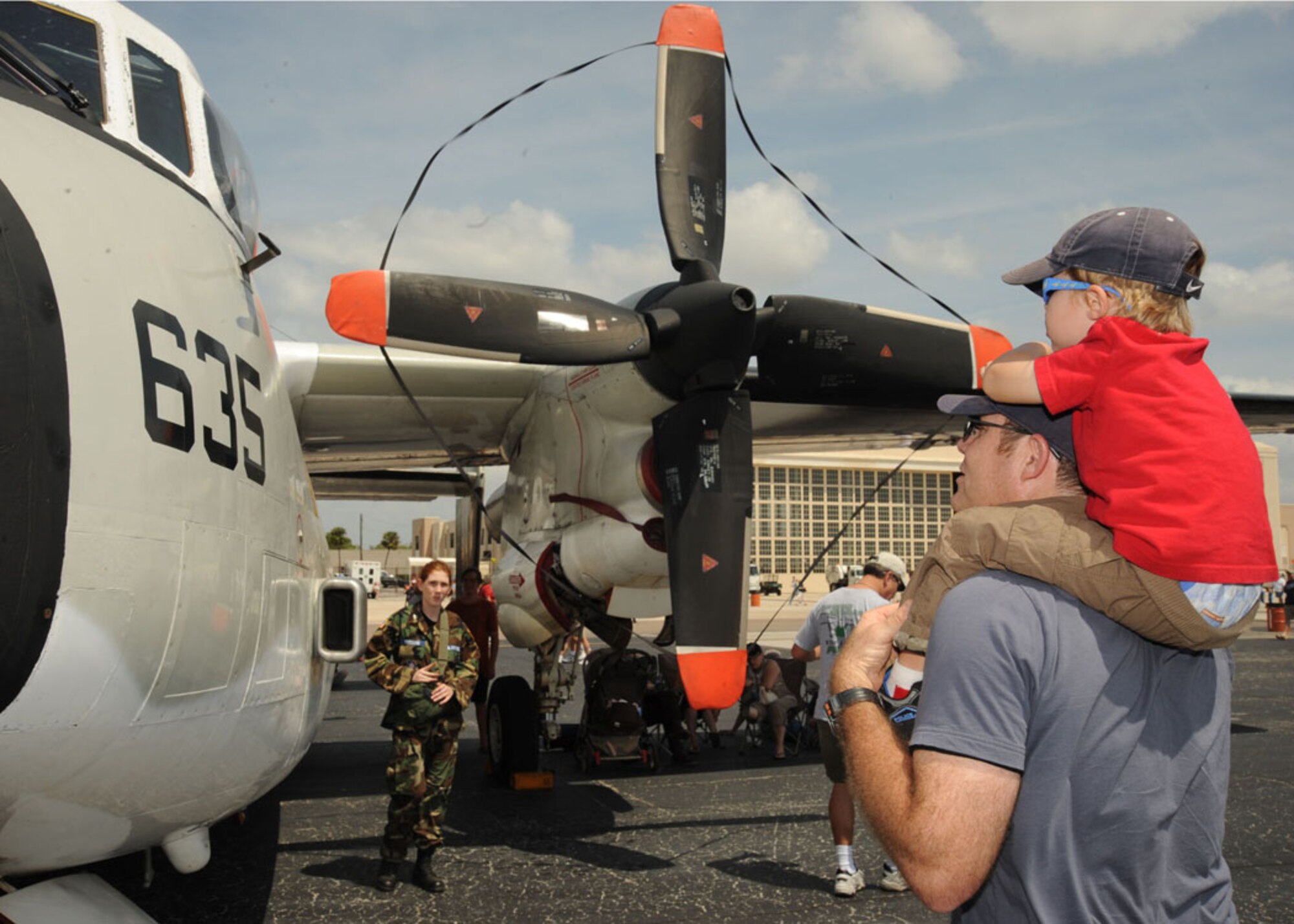 Deon Esterhuizen and son Ryan, 3, of Tampa, view a static display during the 2009 Airfest at Macdill Air Force Base March 28. The 2009 Airfest was the host to spectacular aerial demonstrations, static displays and featured the Air Force Thunderbirds. The Thunderbirds celebrated 55 years of representing America's Airmen. The Airfest gave the Tampa Bay community the opportunity to witness firsthand the capabilities of the armed forces. With a turnout of approximately 75,000 spectators, day one of the two-day air show was a success. 
(U. S. Air Force photo by Airman 1st Class Linzi Joseph)