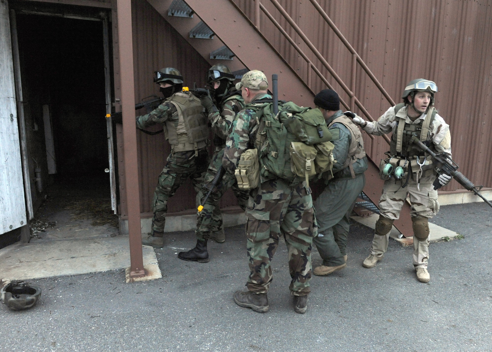 LANGLEY AIR FORCE BASE Va. -- Survival, Evasion, Resistance and Escape cadre leads downed pilots to a secure location during a training exercise here March 25. SERE training is part of a refresher course in order to test the skills of downed pilots in enemy territory. (U.S. Air Force photo/Airman 1st Class Jonathan Koob)