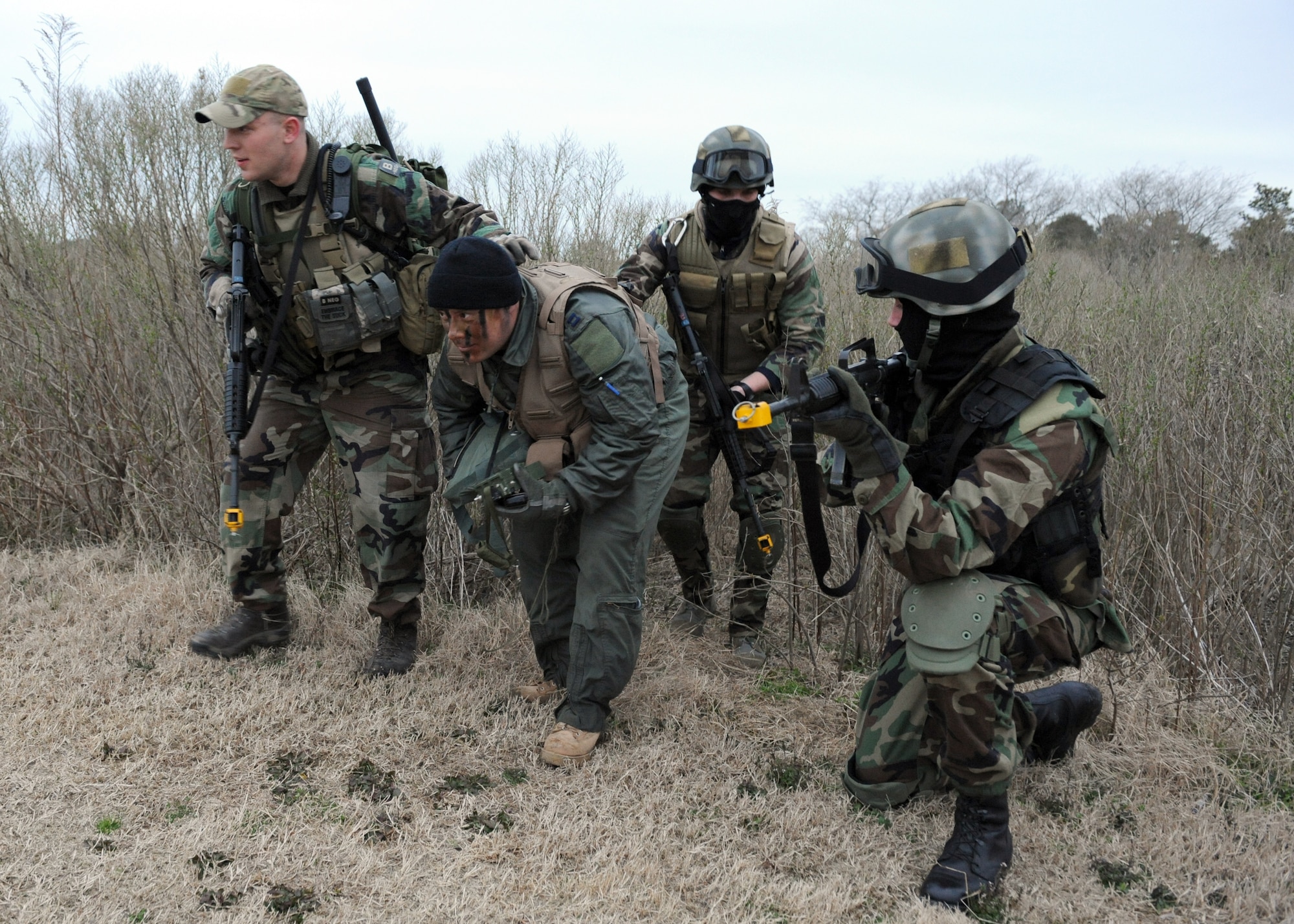 LANGLEY AIR FORCE BASE Va. -- Survival, Evasion, Resistance and Escape cadre leads downed pilots to a secure location during a training exercise here March 25. SERE training is part of a refresher course in order to test the skills of downed pilots in enemy territory. (U.S. Air Force photo/Airman 1st Class Jonathan Koob)