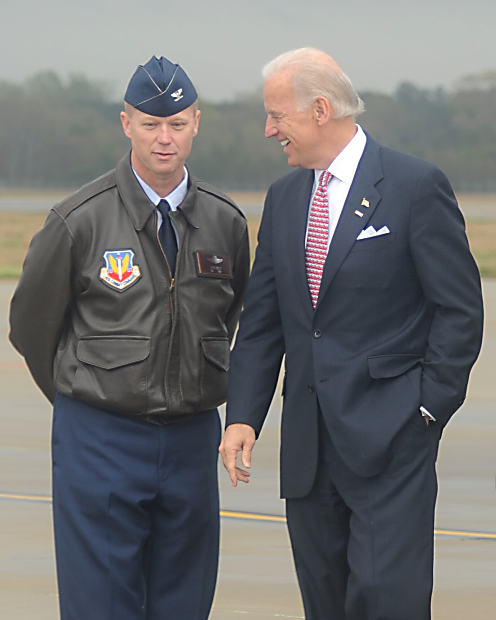 Vice President Joe Biden speaks with Col. Mark Kelly, 4th Fighter Wing commander, after arriving at Seymour Johnson Air Force Base, N.C., April 1, 2009. The Vice President visited rural areas near the base to tout stimulus bill funding for local projects. (U.S. Air Force photo by Staff Sgt. Jessica Varrato)

