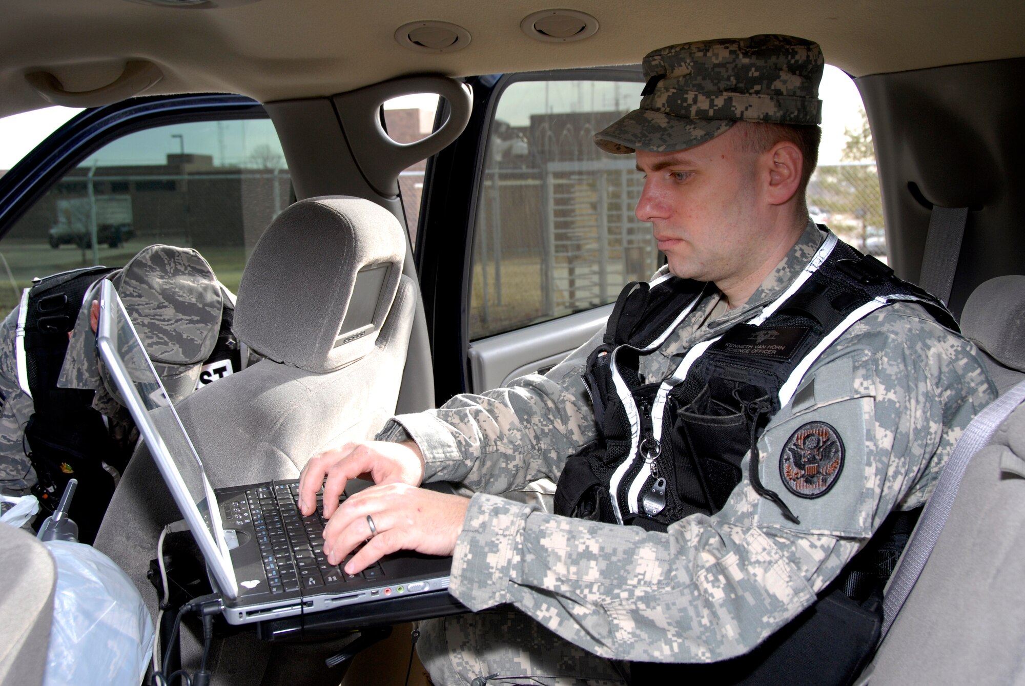 Capt. Kenneth Van Horn, 54th Civil Support Team science officer, examines data suspicious package and response protocols for a "suspicious" package during an exercise here March 18. The joint exercise included many different units on Truax Field as well as the U.S. Postal Service, Federal Bureau of Investigation and the 54th CST. (U.S. Air Force Photo by Master Sgt. Dan Richardson)
