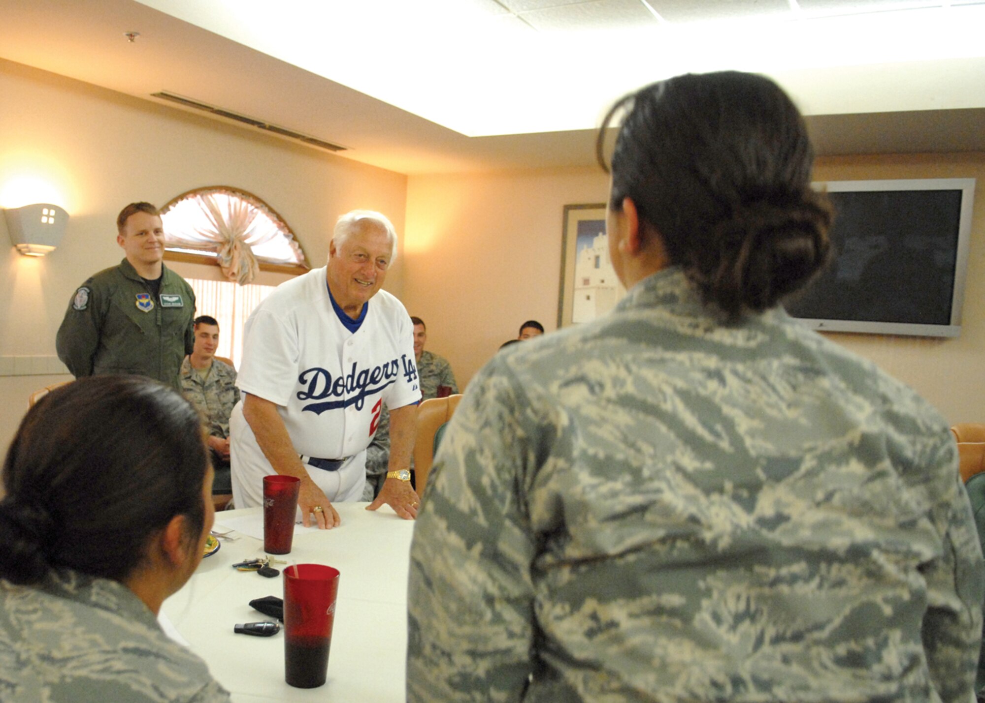 Tommy Lasorda visits with Luke Airmen during a luncheon at the Desrt Star Club March 25. Mr. Lasorda visited the base and had the chance to meet a number of Airmen face-to-face as well as speak to Airmen during Warrior Call that afternoon.(Photo by Deborah Silliman Wolfe)