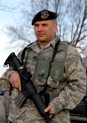 Tech. Sgt. Michael Harvey, 115th Security Forces Squadron, provides cordon security  around Bldg. 500 following a report of a suspicious package during an exercise here March 18. The joint exercise included many different units on Truax Field as well as the U.S. Postal Service, Federal Bureau of Investigation and the 54th Civil Support Team. (U.S. Air Force Photo by Master Sgt. Dan Richardson)