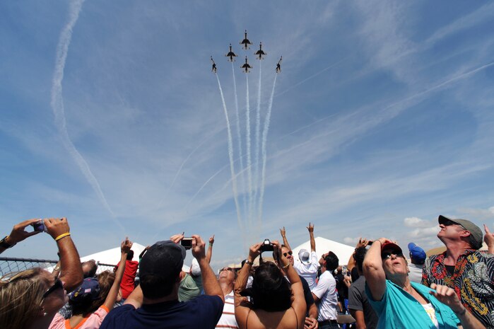 The U.S. Air Force Thunderbirds soar over the crowd attending the 2009 MacDill Airfest, Mar. 28.  The Thunderbirds will be performing in over 70 shows this year, to include stops in Puerto Rico and the Far East.  USAF Photo by Staff Sgt. Kristi Machado (RELEASED)