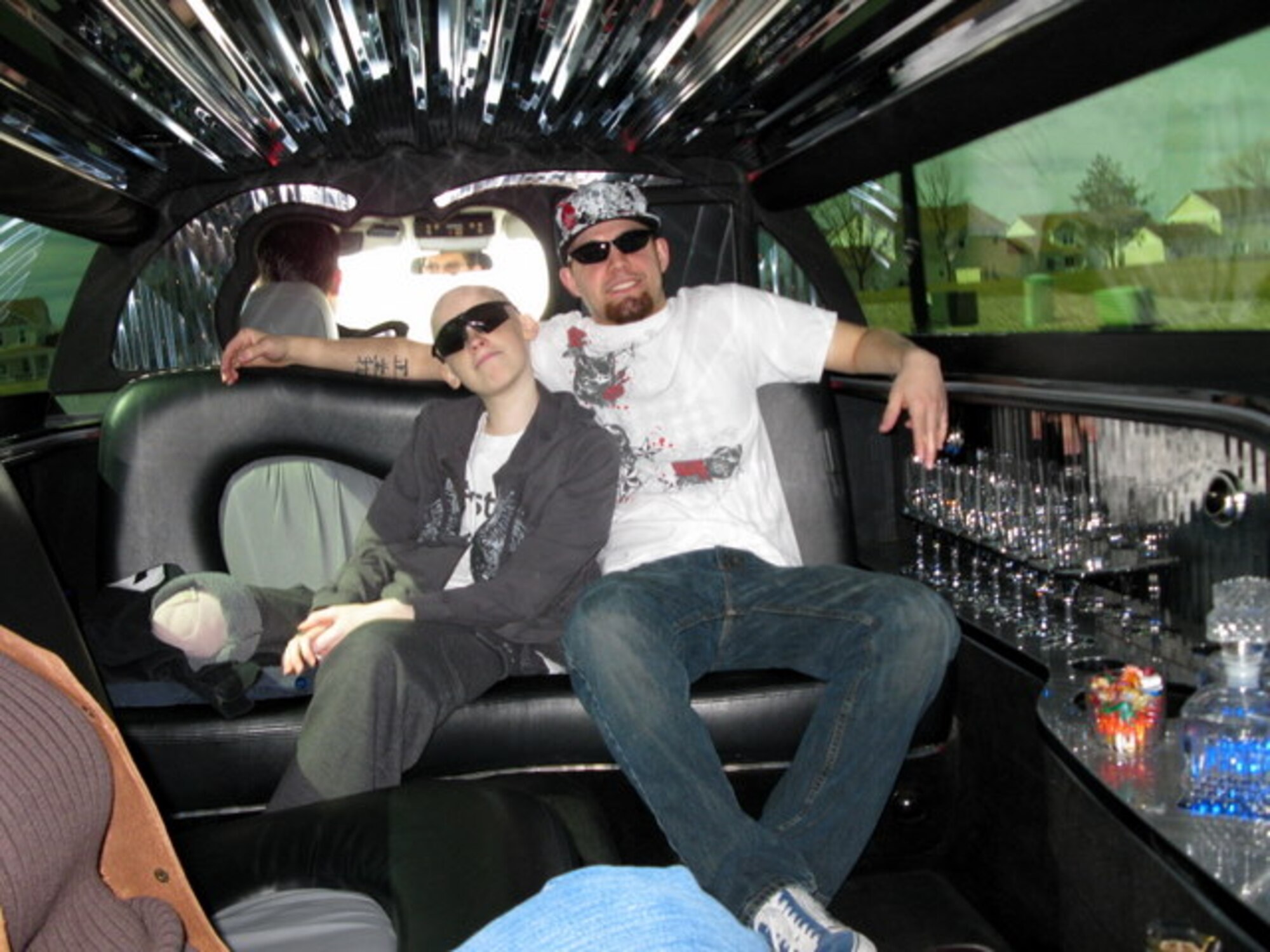 MOUNTAIN HOME AIR FORCE BASE, Idaho - Left, Ty and Josh Ulmer pose for a picture March 28 in the back of a limo. Ty, who was diagnosed with osteosarcoma Sept. 11, 2008, received a shopping spree from the Make-A-Wish Foundation of Idaho. His father, Master Sgt. Darrin Ulmer, works for the 366th Security Forces Squadron. (Courtesy photo)