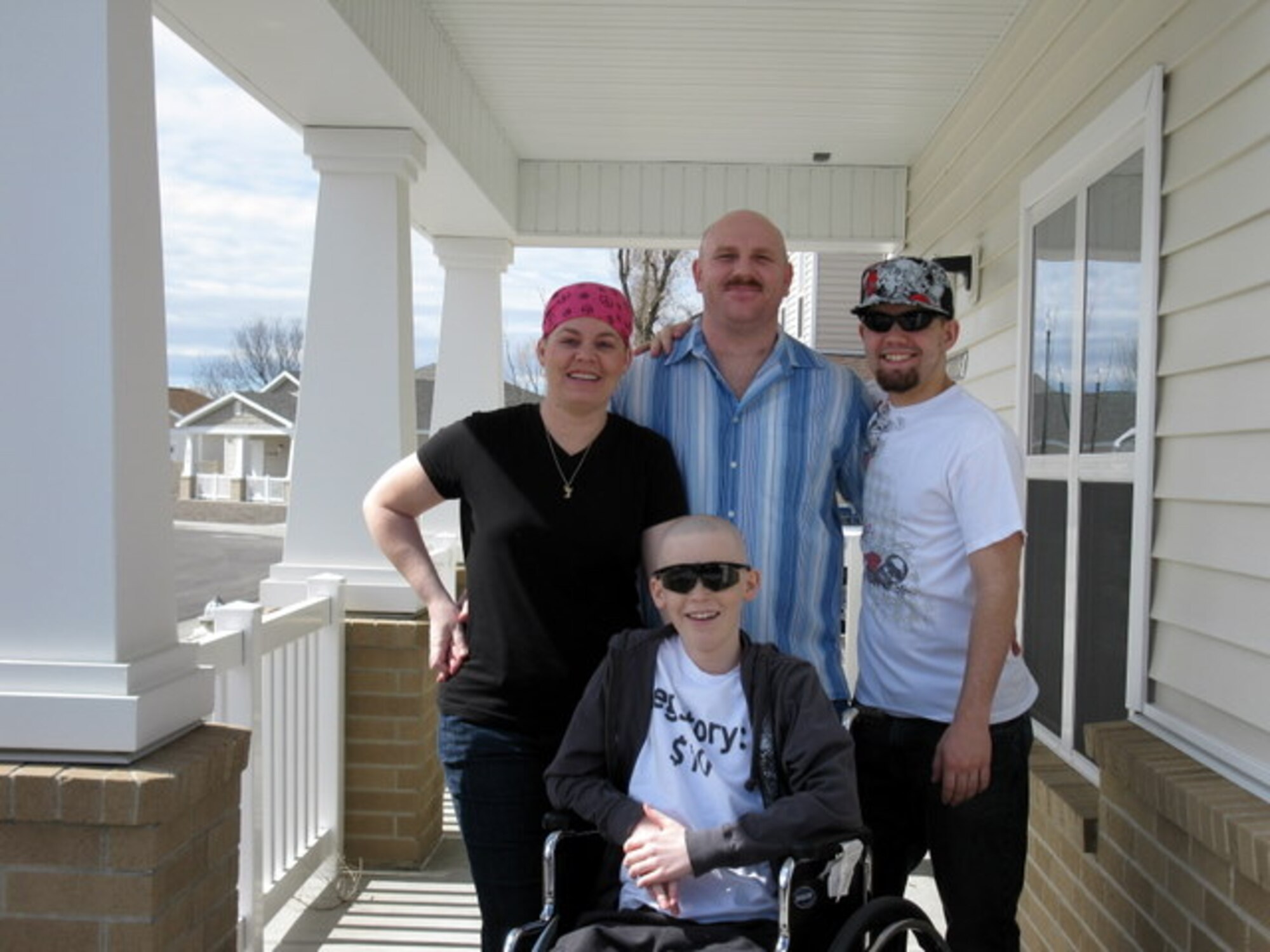 MOUNTAIN HOME AIR FORCE BASE, Idaho - Left, Kim, Darrin, Josh and Ty Ulmer pose for a picture March 28 before their limo ride to Boise, Idaho. Ty, who was diagnosed with osteosarcoma Sept. 11, 2008, received a shopping spree from the Make-A-Wish Foundation of Idaho. His father, Master Sgt. Darrin Ulmer, works for the 366th Security Forces Squadron. (Courtesy photo)