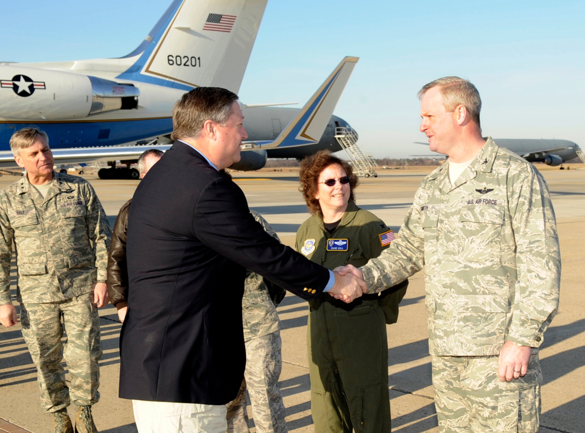 Col. Scott Smith, 305th Air Mobility Wing commander, welcomes Secretary of the Air Force Michael B. Donley as he arrives here March 31. During his visit to McGuire, Secretary Donley held a SECAF call to share his thoughts on the Total Force and the significance of the Joint Base concept. Secretary Donley also presented three Air Force Combat Action Medals to McGuire Airmen during the call. (U.S. Air Force photo/Carlos Cintron)