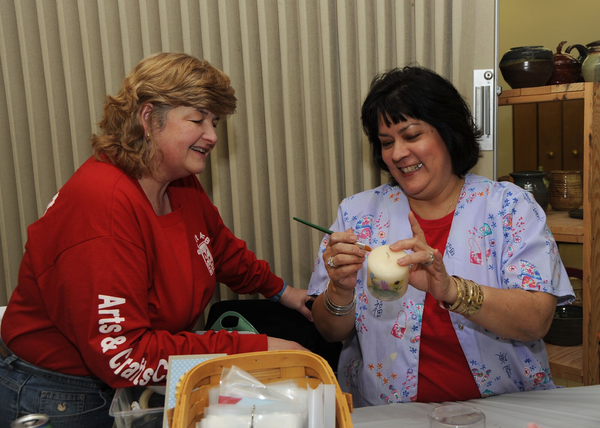 SCOTT AIR FORCE BASE, Ill. --Joni Doolin from Shiloh, Ill. shows Jan Hoyt of O’fallon, Ill. proper candle painting techniques.(U.S. Air Force photo/Tech. Sgt. Michelle Larche) 