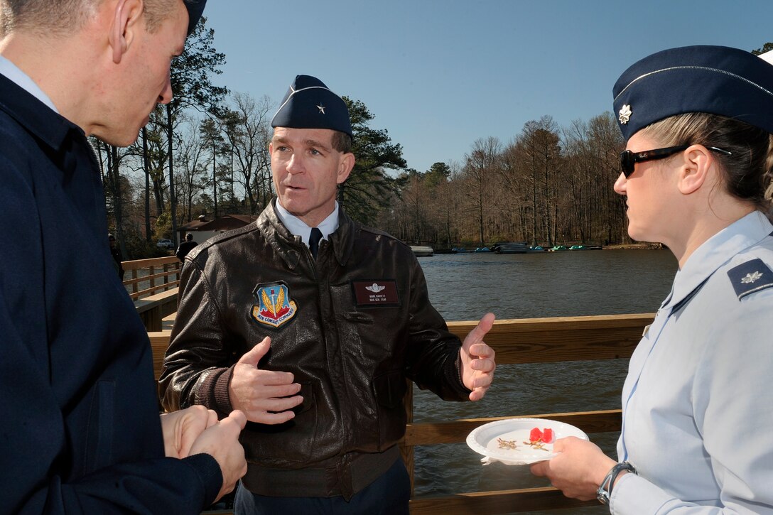 LANGLEY AIR FORCE BASE, Va. --  Brig. Gen. Mark A. Barrett, 1st Fighter Wing commander, speaks with Col. Eric Stone, 1st Medical Group commander, and Lt. Col. Caroline Miller, 1st Force Support Squadron commander, about the re-opening of the Bethel Fishing Pier March 30.  Contractors from the 1st Civil Engineer Squadron worked for about 100 days to complete the fishing pier reconstruction for military personnel and their dependents. (U.S. Air Force photo/Senior Airman Vernon Young)