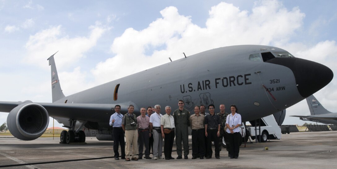 Andersen Air Force Base, Guam -- Lt. Col. Laen August, 72nd Air Refueling Squadron commander (center), along with Senior Airmen Christopher Israel and Davis Englehardt of the 434th Aircraft Maintenance Squadron, hosted members of the Niigata, Japan, Rotary club for a tour of a KC-135R Stratotanker.  Aircraft and personnel from the 434th Air Refueling Wing at Grissom ARB are deployed to Andersen AFB.  The tour of the KC-135 was one of the outreach activities 434th ARW personnel have been involved in during their stay in Guam.  (U.S. Air Force photo/Staff Sgt. Jamie Lessard)
