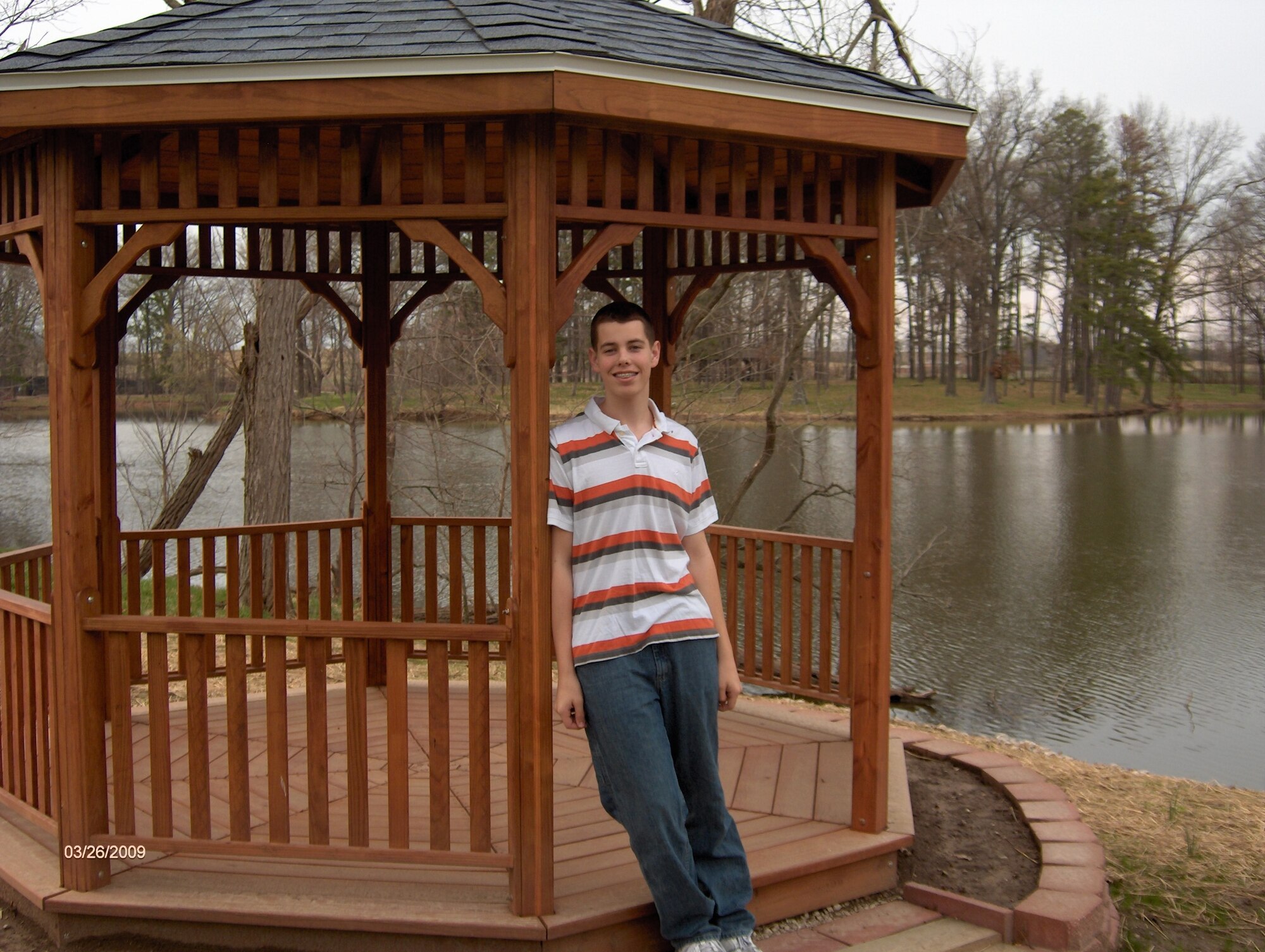 SCOTT AIR FORCE BASE, Ill. -- Alex Messer stands in front of the gazebo that he helped put into place as part of his Eagle Scout project. Alex with help form his friends and family cleared land around Scott Lake and fixed the docks in addition to the gazebo. (Courtesy photo)  