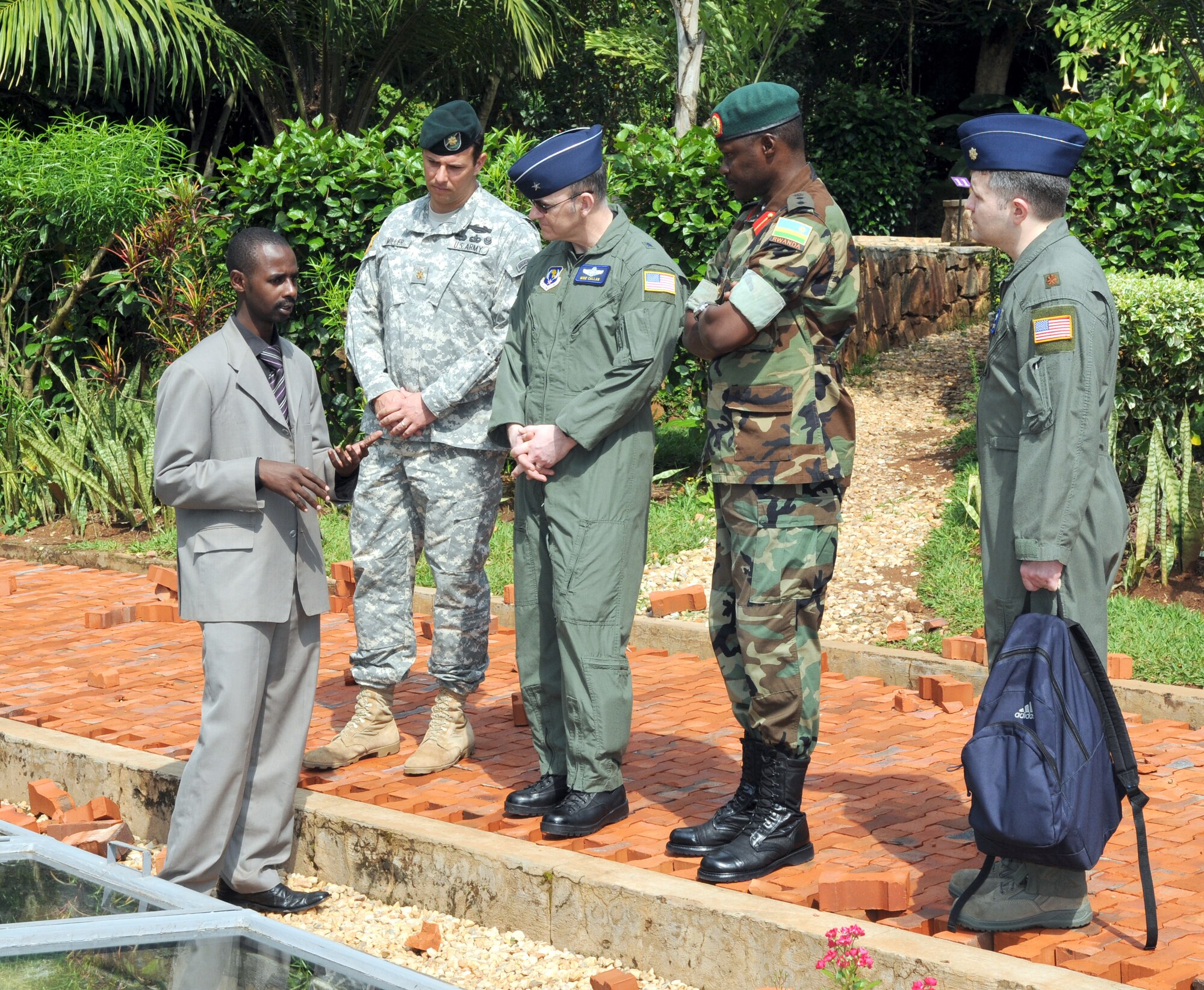 (Left to right) Rwandan Genocide Museum guide Emmanuel Gagasana explains a display with mass graves of victims of the 1994 Rwandan Genocide to Army Maj. Ron Miller, U.S. Defense Attache for Rwanda, Seventeenth Air Fore Vice Commander Brig. Gen. Michael Callan, Rwandan Army Col. Charles Kalamba, and 17th AF's Maj. Alesandro Smith March 25 in Kigali, Rwanda. 
General Callan visited Rwanda and Ethiopia during a senior leader engagement to the continent March 24-28. 
Experts estimate more than 50,000 people are buried on the site of the museum. (USAF photo by Master Sgt. Jim Fisher) 