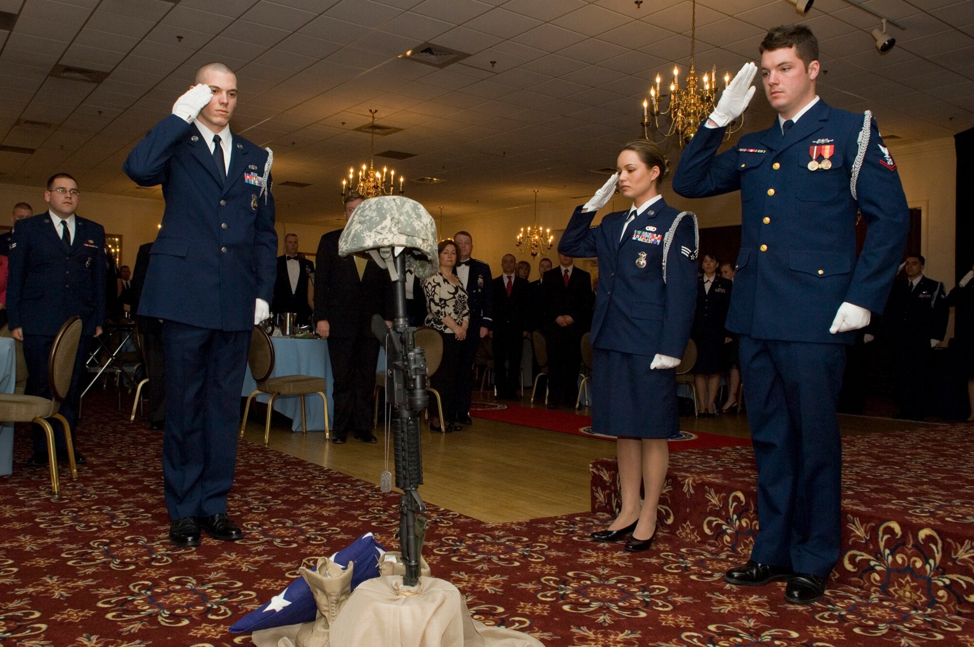 HANSCOM AIR FORCE BASE, Mass. – Airman Leadership School students pay a solemn tribute to fallen military members during the ALS graduation ceremony at the Minuteman Club on March 27.   (U.S. Air Force photo by Mark Wyatt)