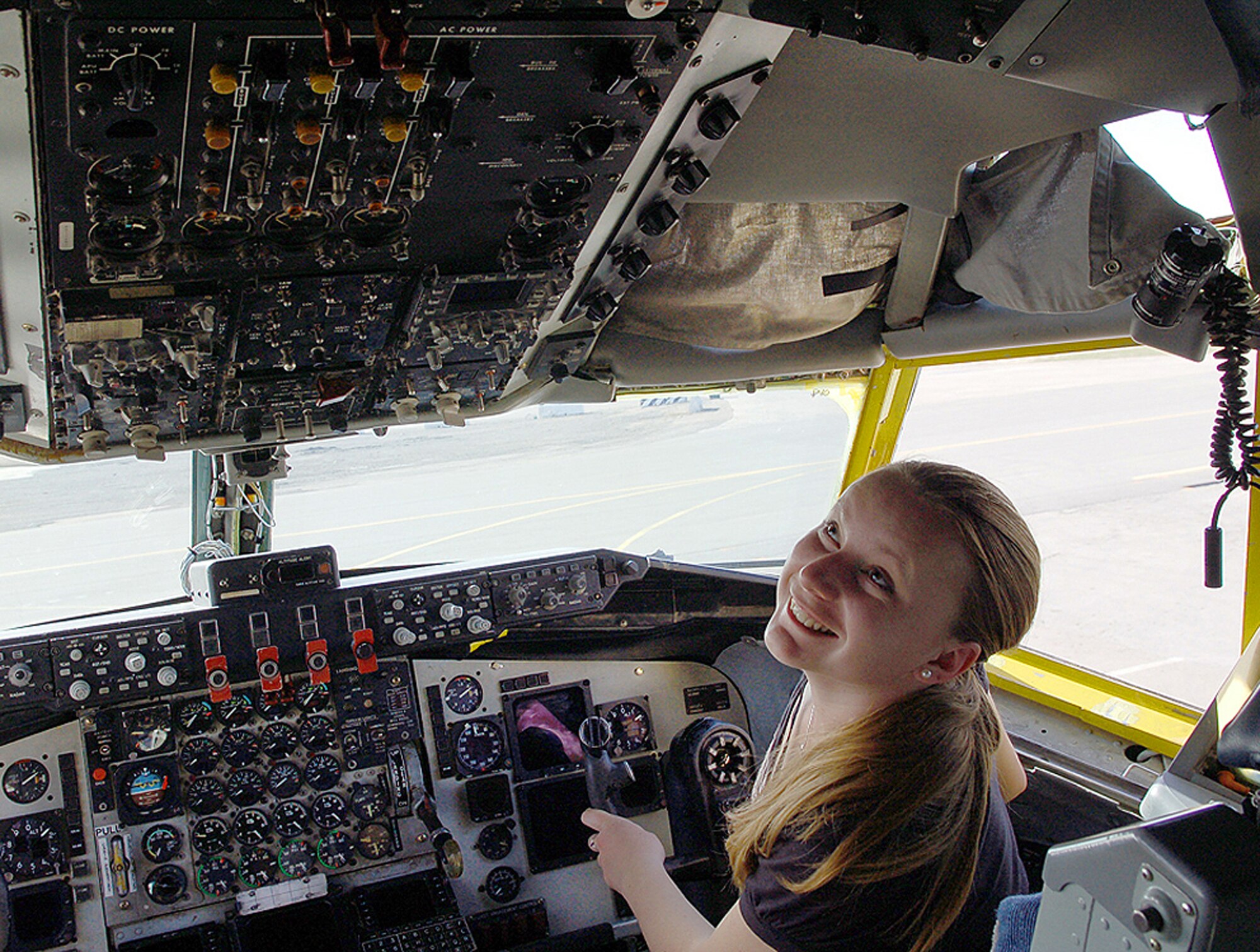 Alesia Bulankina, an American University of Central Asia student, checks out myriad knobs, dials and switches in the cockpit of a KC-135 Stratotanker March 26 at Manas Air Base, Kyrgyzstan. Ms. Bulankina, a 20-year-old junior from Bishkek who is majoring in business administration, visited Manas AB with 12 other students and faculty for an orientation tour and dinner hosted by the 376th Air Expeditionary Wing Public Affairs Office. (U.S. Air Force photo/Tech. Sgt. Phyllis Hanson) 
