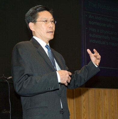 Chief Administrative Judge Kenneth W. Chu of the U.S. Equal Employment Opportunity Commission discusses key supervisor and employee information from the Americans with Disabilities Act and ADA Amendments Act during a Diversity Day presentation, held in the O'Neill Auditorium March 26.  (U.S. Air Force photo by Rick Berry)