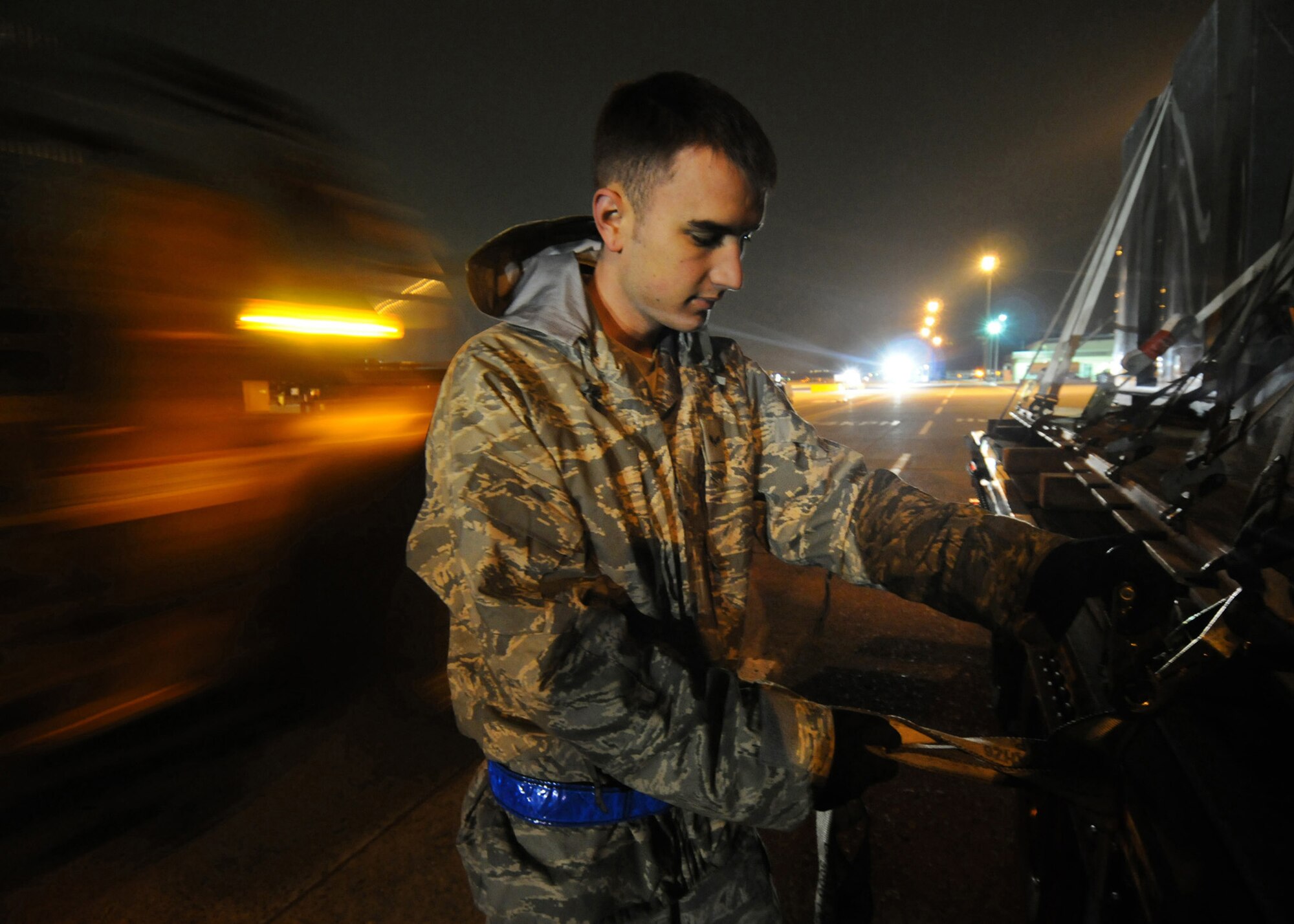 Senior Airman Steven Tawney secures a load of liquid nitrogen on a flat-bed trailer during Phase I of Exercise Beverly Morning 09-03 March 31 at Yokota Air Base, Japan. Base personnel will be conducting the exercise March 30 through April 3 to maintain operational readiness. Airman Tawney is assigned to the 374th Logistics Readiness Squadron. (U.S. Air Force photo/Senior Airman Veronica Pierce) 

