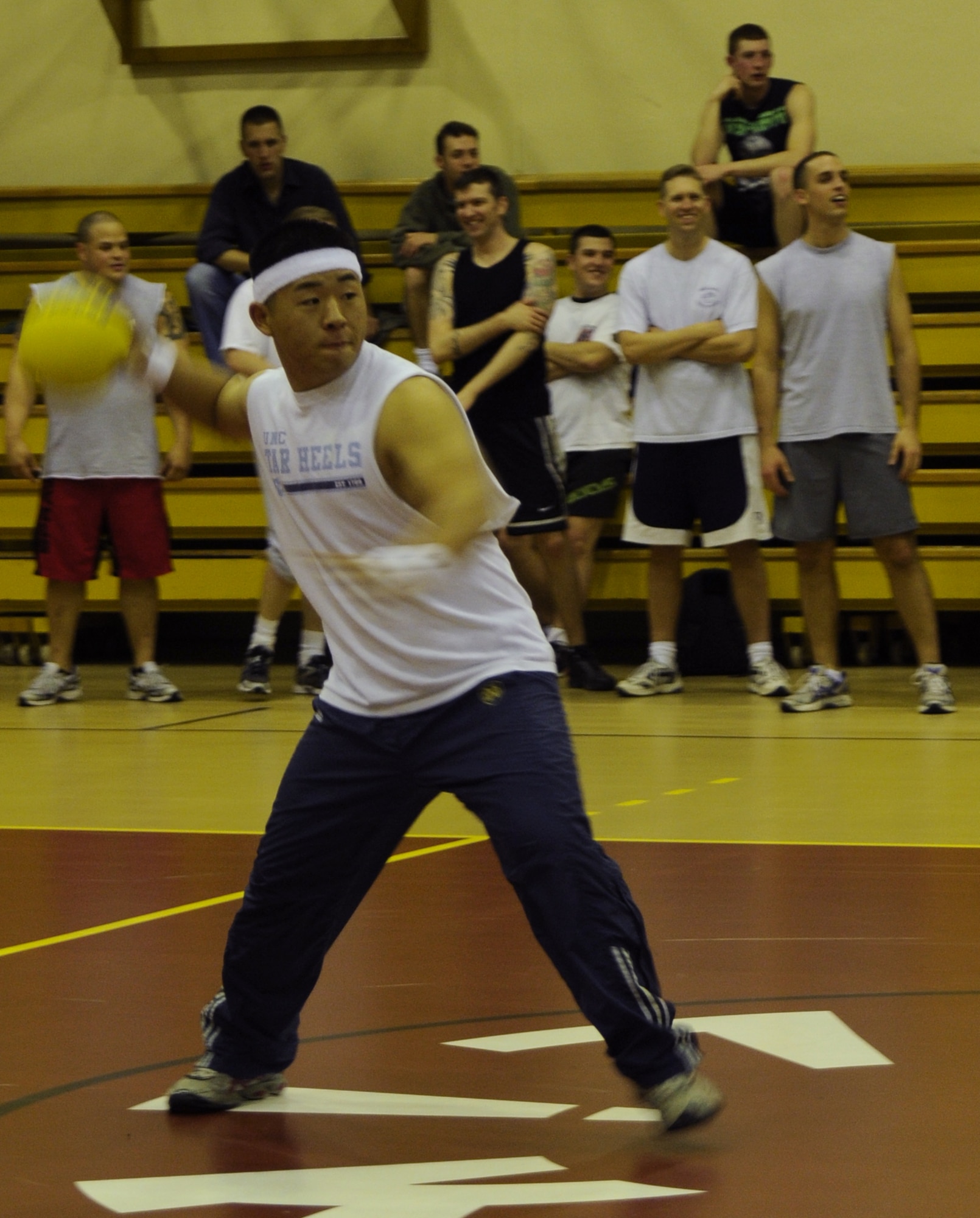 Jones Gold, from the “Executioners,” throws a ball at an unsuspecting victim during “late-night dodgeball” at the Incirlik Fitness Center Friday, March 27, 2009.  The “late-night” games are played to boost morale for the Airmen located at this overseas base. (U.S. Air Force photo/Airman 1st Class Amber Russell, 39th Air Base Wing Public Affairs)