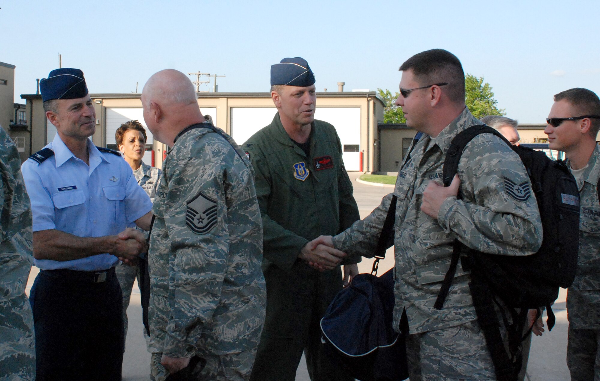 Col. Kevin E. Pottinger, 301st Fighter Wing commander (left) and Col. Bob Mortensen, 301st FW vice commander, express their support to the more than 90 members who deployed out of the Naval Air Station Joint Reserve Base Fort Worth, Texas, Monday evening to support Operation Iraqi Freedom. (U.S. Air Force Photo/Laura Dermarderosian-Smith)