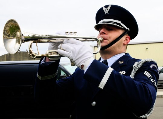 SPANGDAHLEM AIR BASE, Germany -- Senior Airman Justin Lemmon, 52nd Equipment Maintenance Squadron, plays the trumpet during a memorial retreat ceremony for the first Chief Master Sergeant of the Air Force, Paul Airey, March 27, 2009. He held the position from April 1967 to July 1969. He passed away March 11, 2009. (U.S. Air Force photo by Airman 1st Class Nicholas Wilson)