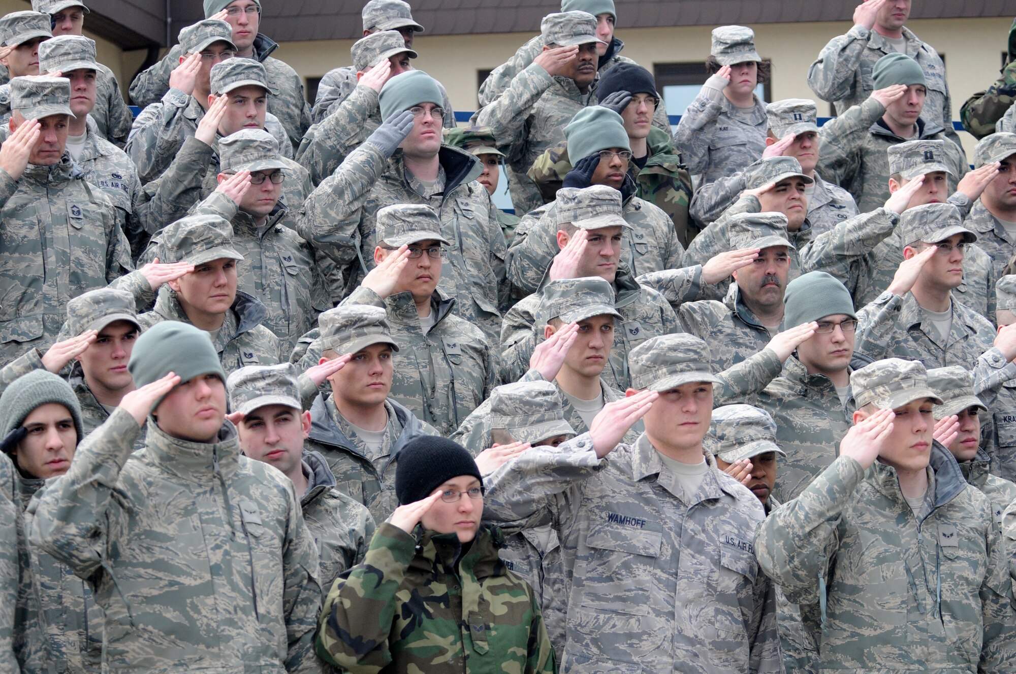 SPANGDAHLEM AIR BASE, Germany -- Members of the 52nd Fighter Wing salute during a memorial retreat ceremony for the first Chief Master Sergeant of the Air Force, Paul Airey, March 27, 2009. Chief Master Sgt. Airey was the first CMSAF. During his tenure he worked to improve low retention during the Vietnam Conflict. CMSAF Airey led a team that laid the foundation for the Weighted Airman Promotion System, and he advocated for an Air Force-level senior noncommissioned officer academy. (U.S. Air Force photo by Master Sgt. Bill Gomez)