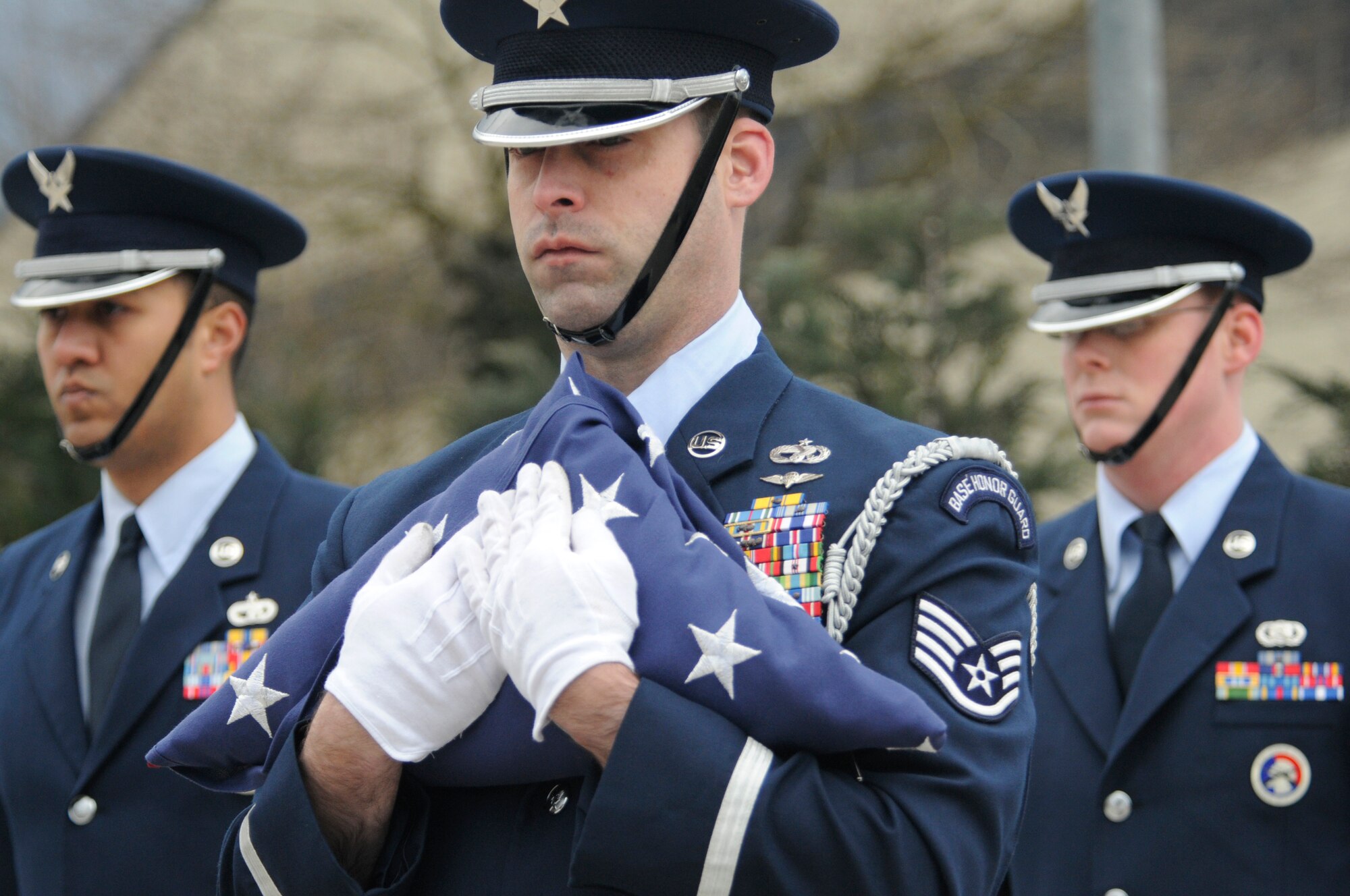 SPANGDAHLEM AIR BASE, Germany – Staff Sgt. Lee Haynor, 52nd Logistics Readiness Squadron, along with members of the 52nd Fighter Wing Base Honor Guard hold the American flag during a memorial retreat ceremony for the first Chief Master Sergeant of the Air Force, Paul Airey, March 27, 2009. He held the position from April 1967 to July 1969. (U.S. Air Force photo by Master Sgt. Bill Gomez)
