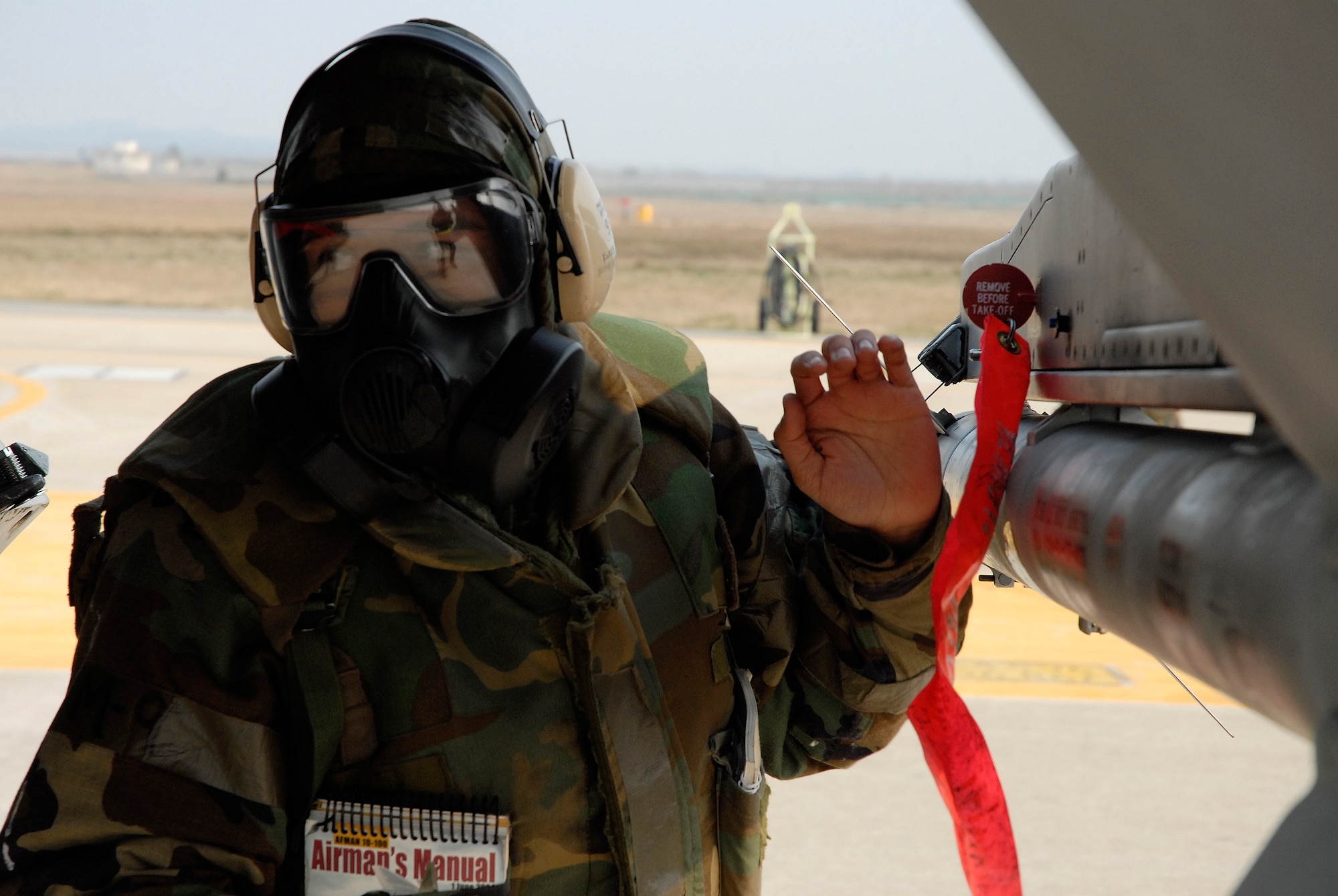 Staff Sgt Gabriel Herrera, 8th Aircraft Maintenance Squadron, inserts safety pins to de-arm an F-16 Fighting Falcon at Kunsan Air Base, Republic of Korea, Apr. 01, 2009. Kunsan Airmen are currently participating in Peninsula-wide Operational Readiness ExerciseBev erly Bulldog 09-02,  in preparation for an Operational Readiness Inspection. (U.S. Air Force Photo by Staff Sgt. Jason Colbert)