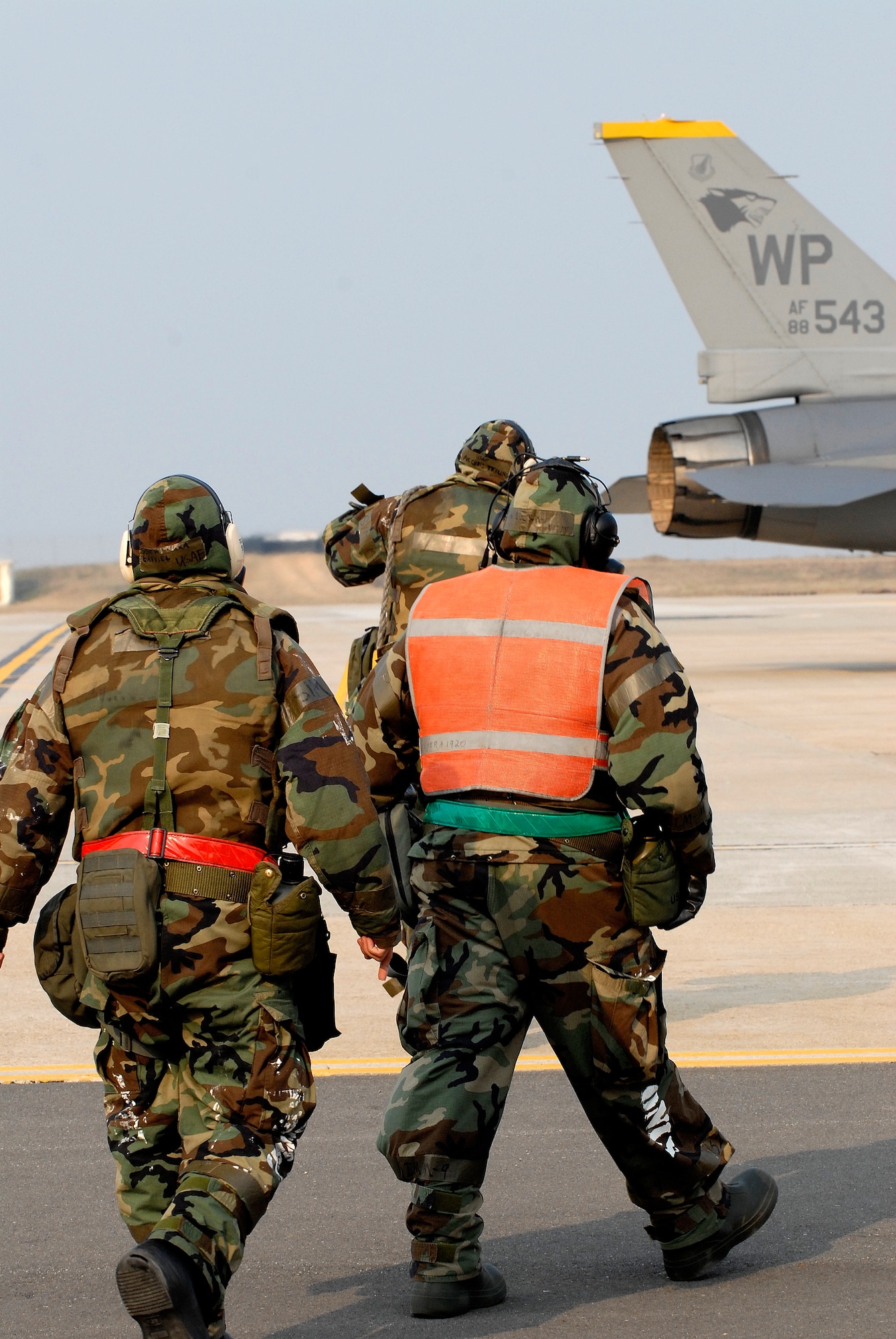 Members of the 8th Aircraft Maintenance Squadron and the 8th Maintenance Squadron head out to de-arm an F-16 Fighting Falcon at Kunsan Air Base, Republic of Korea, April 1, 2009. Kunsan Airmen are currently participating in Peninsula-wide Operational Readiness Exercise Bev erly Bulldog 09-02,  in preparation for an Operational Readiness Inspection. (U.S. Air Force Photo by Staff Sgt. Jason Colbert)