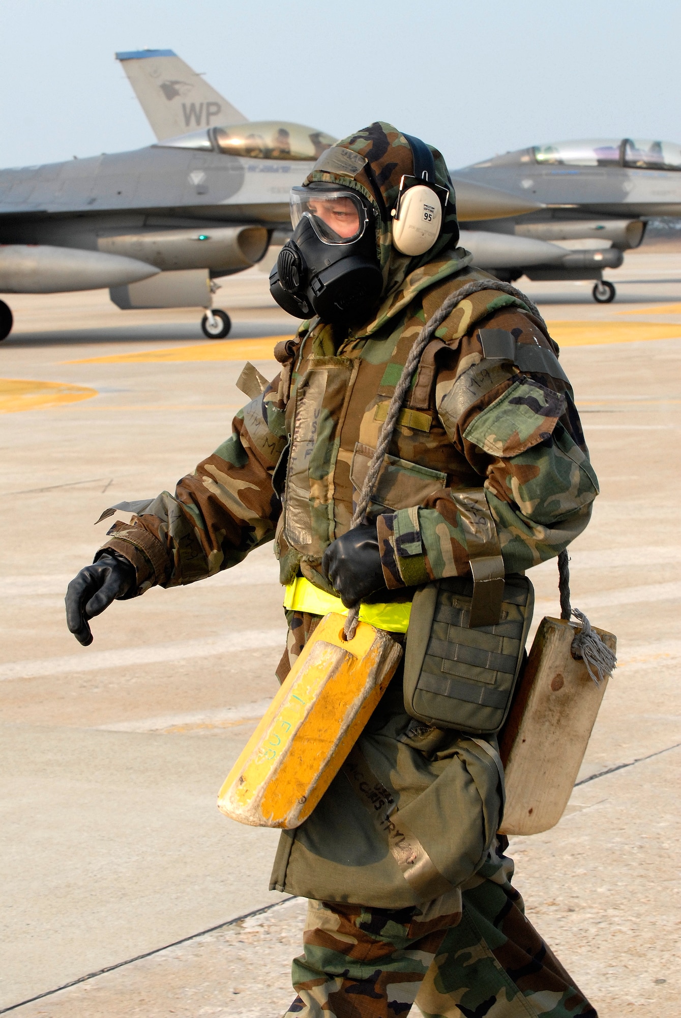Airman 1st Class Chris Tryling, 8th Maintenance Squadron, heads back to shelter after de-arming an F-16 Fighting Falcon at Kunsan Air Base, Republic of Korea, April 1, 2009. Kunsan Airmen are currently participating in Peninsula-wide Operational Readiness Exercise Bev erly Bulldog 09-02, in preparation for an Operational Readiness Inspection. (U.S. Air Force Photo by Staff Sgt. Jason Colbert)
