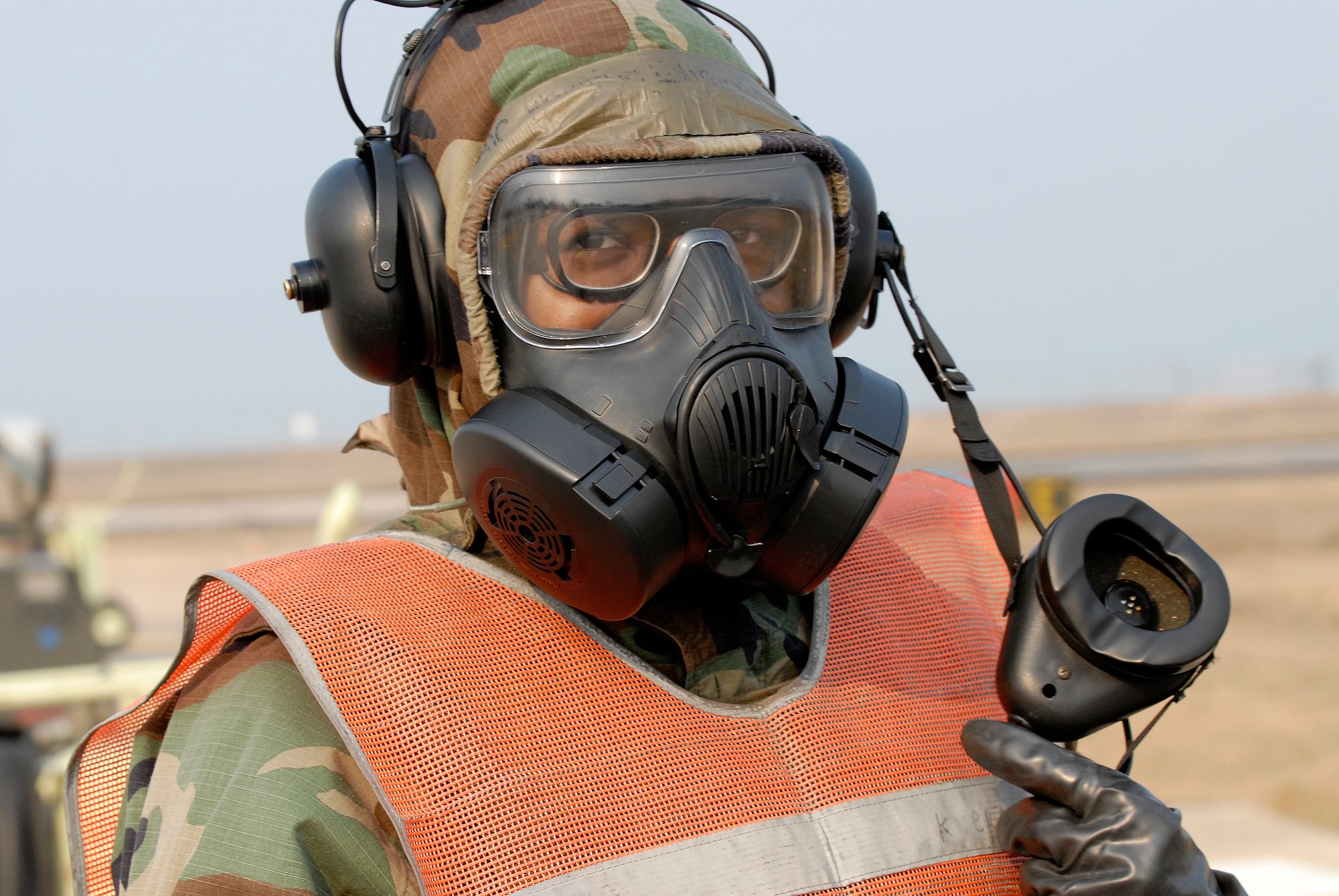 Airman 1st Class Shenise Edmonds, 8th Aircraft Maintenance Squadron, heads back to shelter after de-arming an F-16 Fighting Falcon at Kunsan Air Base, Republic of Korea, April 1, 2009. Kunsan Airmen are currently participating in Peninsula-wide Operational Readiness Exercise Bev erly Bulldog 09-02, in preparation for an Operational Readiness Inspection. (U.S. Air Force Photo by Staff Sgt. Jason Colbert)