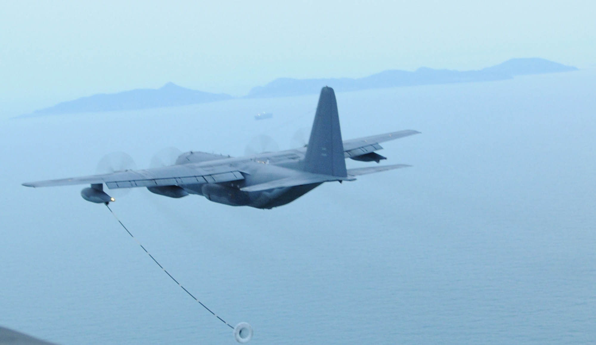 OVER THE REPUBLIC OF KOREA -- A MC-130P Combat Shadow from the 17th Special Operations Squadron releases a hose and drogue refueling pod to refuel a U.S. Army MH-47 helicopter from the 160th Special Operations Aviation Regiment (Airborne) during a training mission here March 30 during Foal Eagle 2009.  Foal Eagle is an annual combined training exercise for U.S. and Republic of Korea forces to evaluate and improve their ability to coordinate procedures, plans and systems necessary to defend the ROK. The 17th SOS is deployed from Kadena Air Base, Japan, and the 160th SOAR is deployed from Fort Lewis, Wash. (U.S. Air Force photo by Tech. Sgt. Aaron Cram)