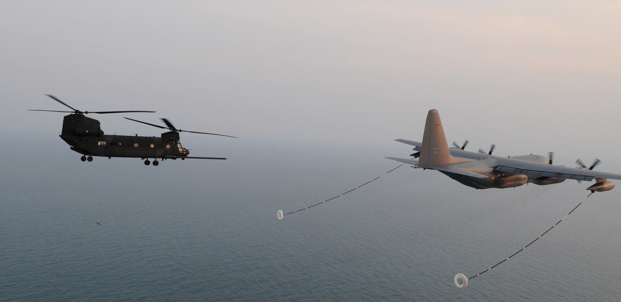 OVER THE REPUBLIC OF KOREA -- A U.S. Army MH-47 helicopter from the 160th Special Operations Aviation Regiment (Airborne) lines up to refuel from a 17th Special Operations Squadron MC-130P Combat Shadow during a training mission here March 30 during Foal Eagle 2009.  Foal Eagle is an annual combined training exercise for U.S. and Republic of Korea forces to evaluate and improve their ability to coordinate procedures, plans and systems necessary to defend the ROK. The 17th SOS is deployed from Kadena Air Base, Japan, and the 160th SOAR is deployed from Fort Lewis, Wash. (U.S. Air Force photo by Tech. Sgt. Aaron Cram)